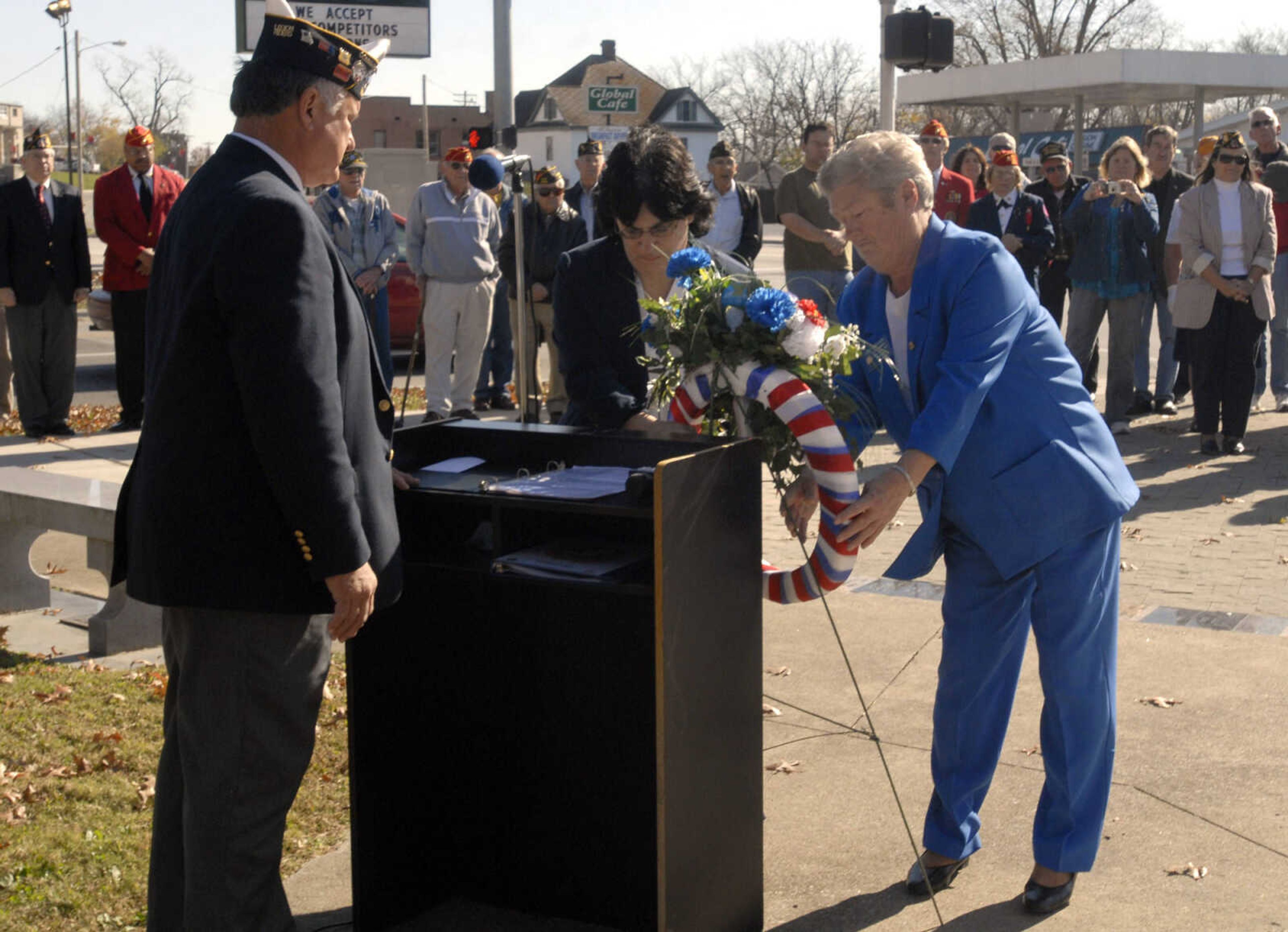 Laying of the wreath: VFW Post 3838 Auxiliary members Judith Beister, right, and Helen Heise.