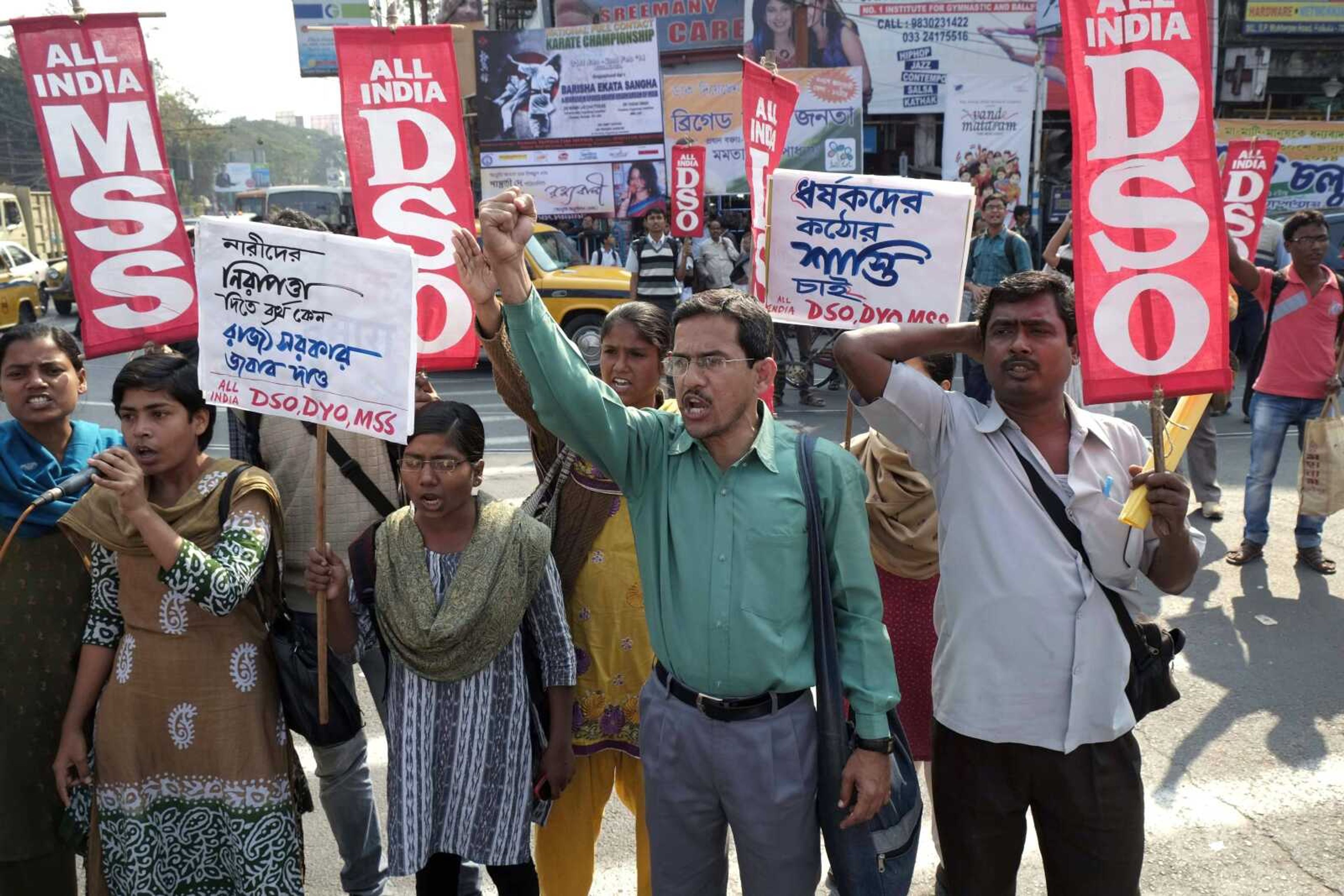 Activists of All India Democratic Students&#8217; Organization shout slogans Saturday in Kolkata, India, as they block a road protesting the gang rape of a 20-year woman in Subalpur. India&#8217;s Supreme Court has ordered an investigation into the gang rape, allegedly attacked on the direction of a village council, Press Trust of India news agency said Friday. (Bikas Das ~ Associated Press)