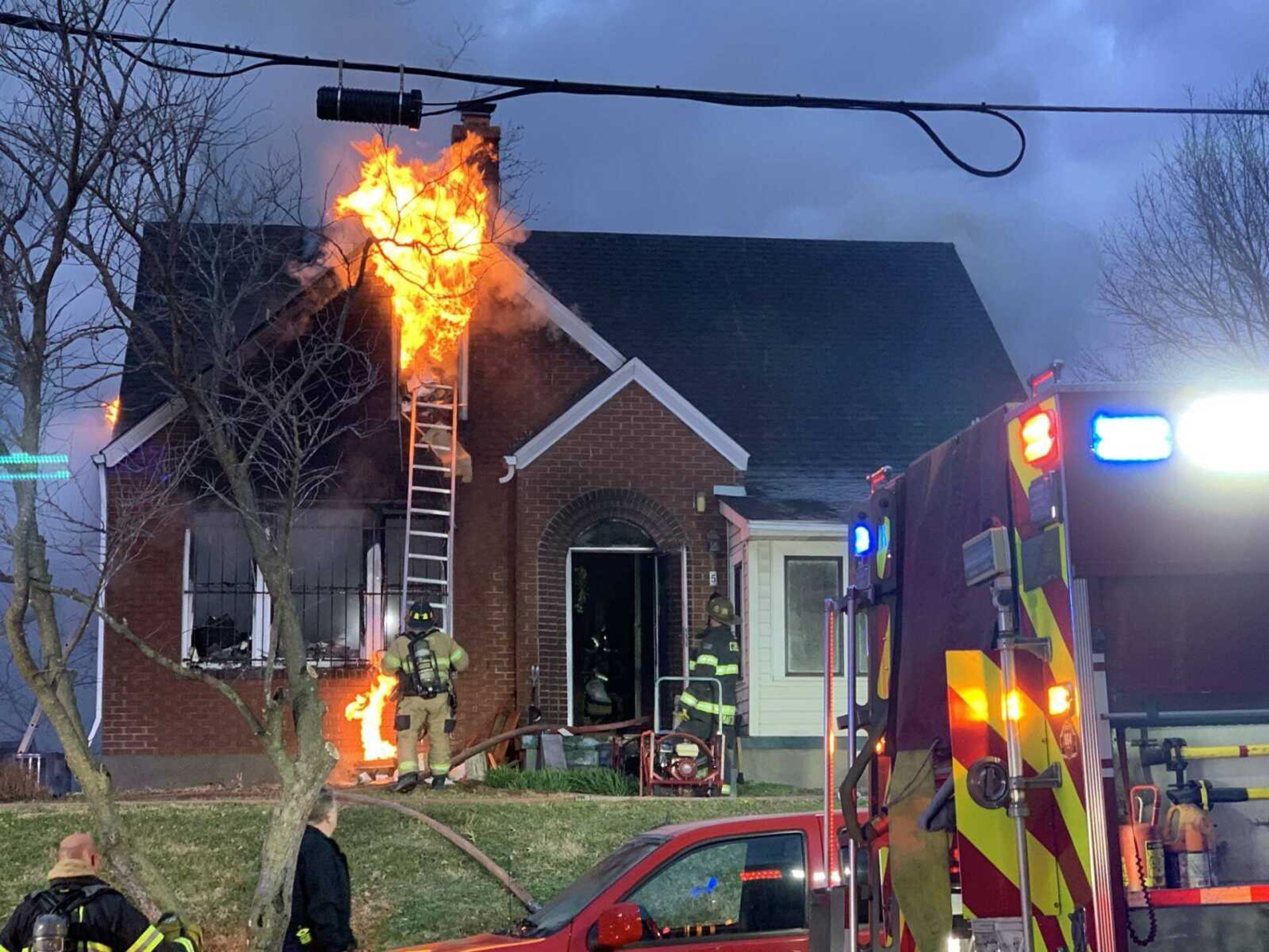 Cape Girardeau Fire Department personnel fight a house fire at the northwest corner of Fountain and Independence streets Friday morning, Jan. 5.