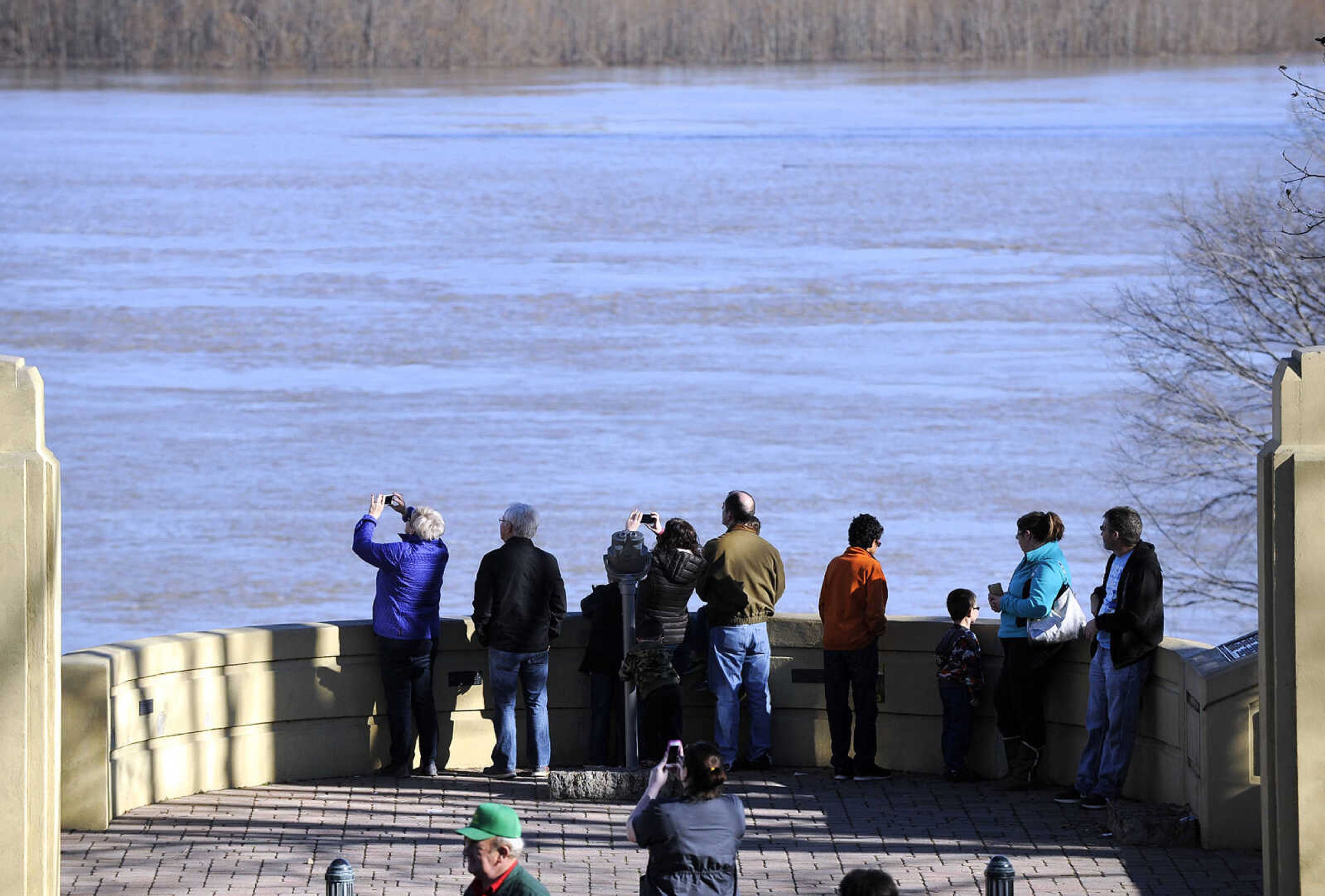 LAURA SIMON ~ lsimon@semissourian.com

People flood to the old Cape Girardeau bridge overlook to catch a glimpse of the swollen Mississippi River, Saturday, Jan. 2, 2016.