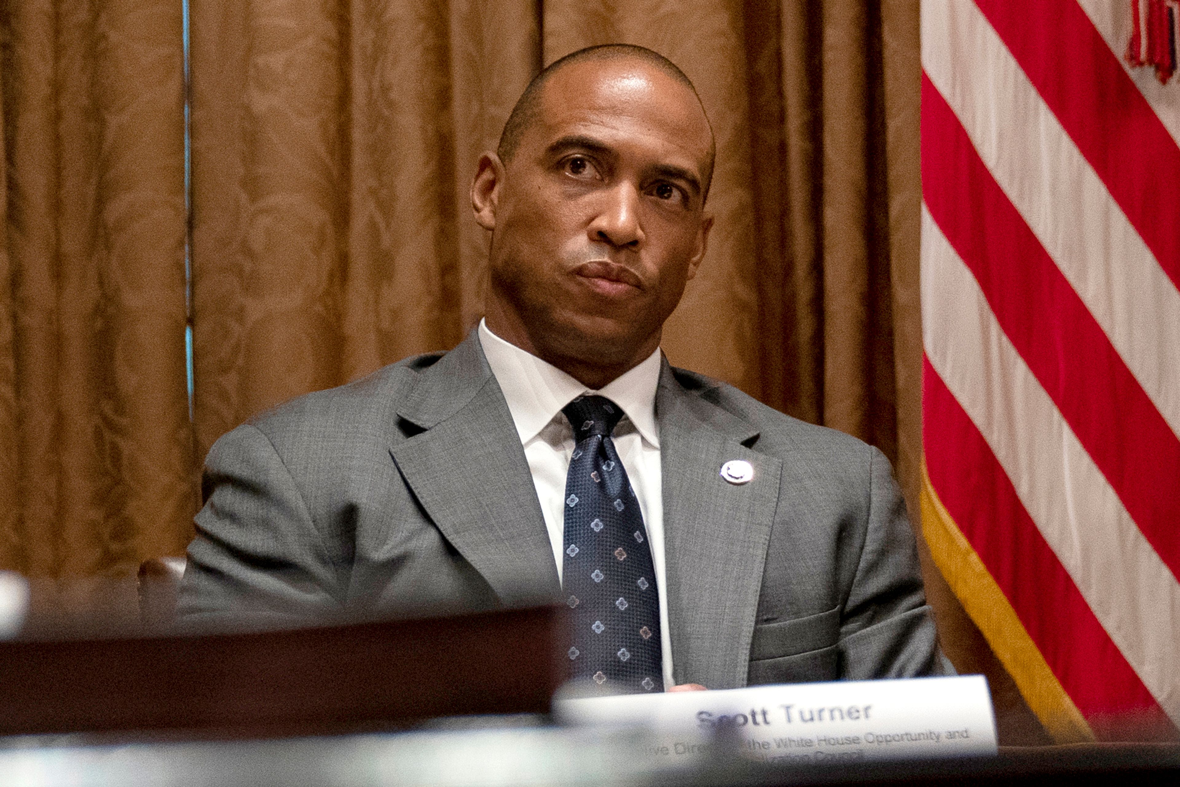 FILE - Scott Turner, the executive director of the White House Opportunity and Revitalization Council, attends a meeting in the Cabinet Room of the White House, May 18, 2020, in Washington. (AP Photo/Evan Vucci, File)