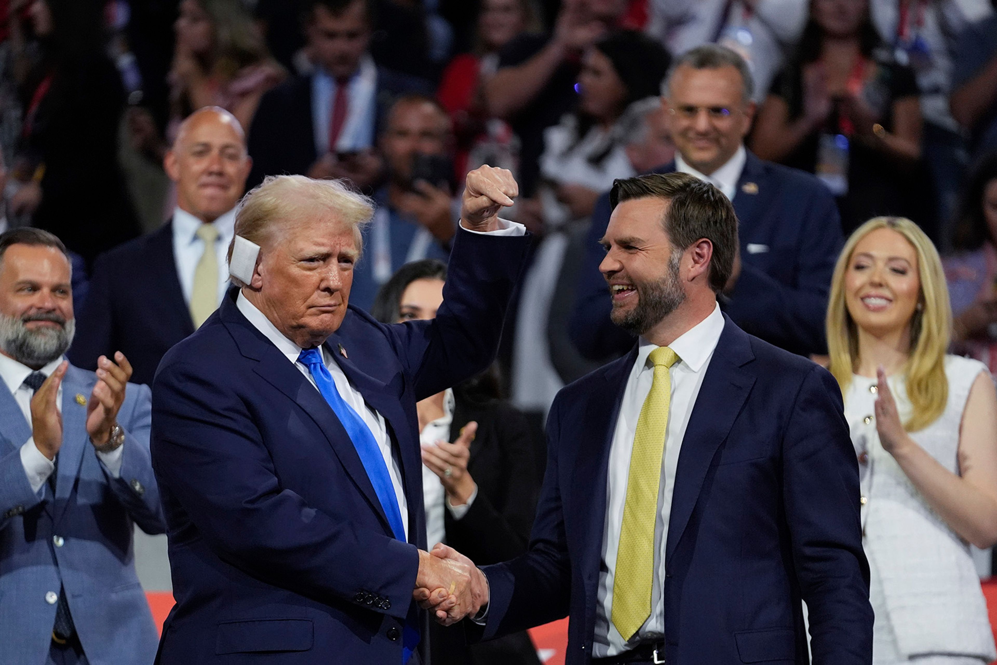 Republican presidential candidate former President Donald Trump is introduced during the Republican National Convention Tuesday, July 16, 2024, in Milwaukee. At right is Republican vice presidential candidate Sen. JD Vance, R-Ohio. 