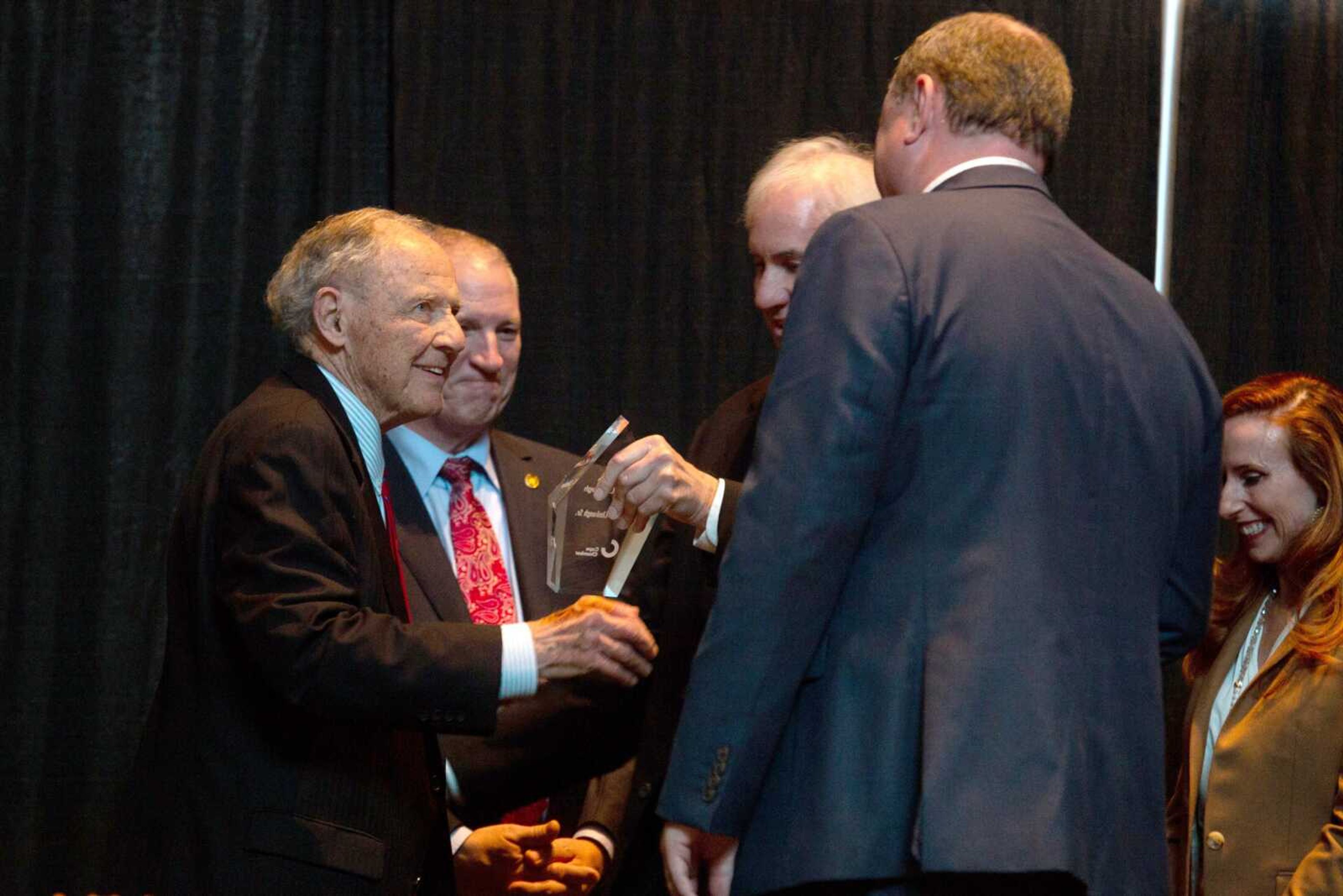 Retired Senior U.S. District Court Judge Stephen N. Limbaugh Sr., left, accepts the Rush H. Limbaugh award at the Cape Girardeau Area Chamber of Commerce annual dinner Friday, March 31, at the Show Me Center in Cape GIrardeau. More photos are in a gallery at semissourian.com.