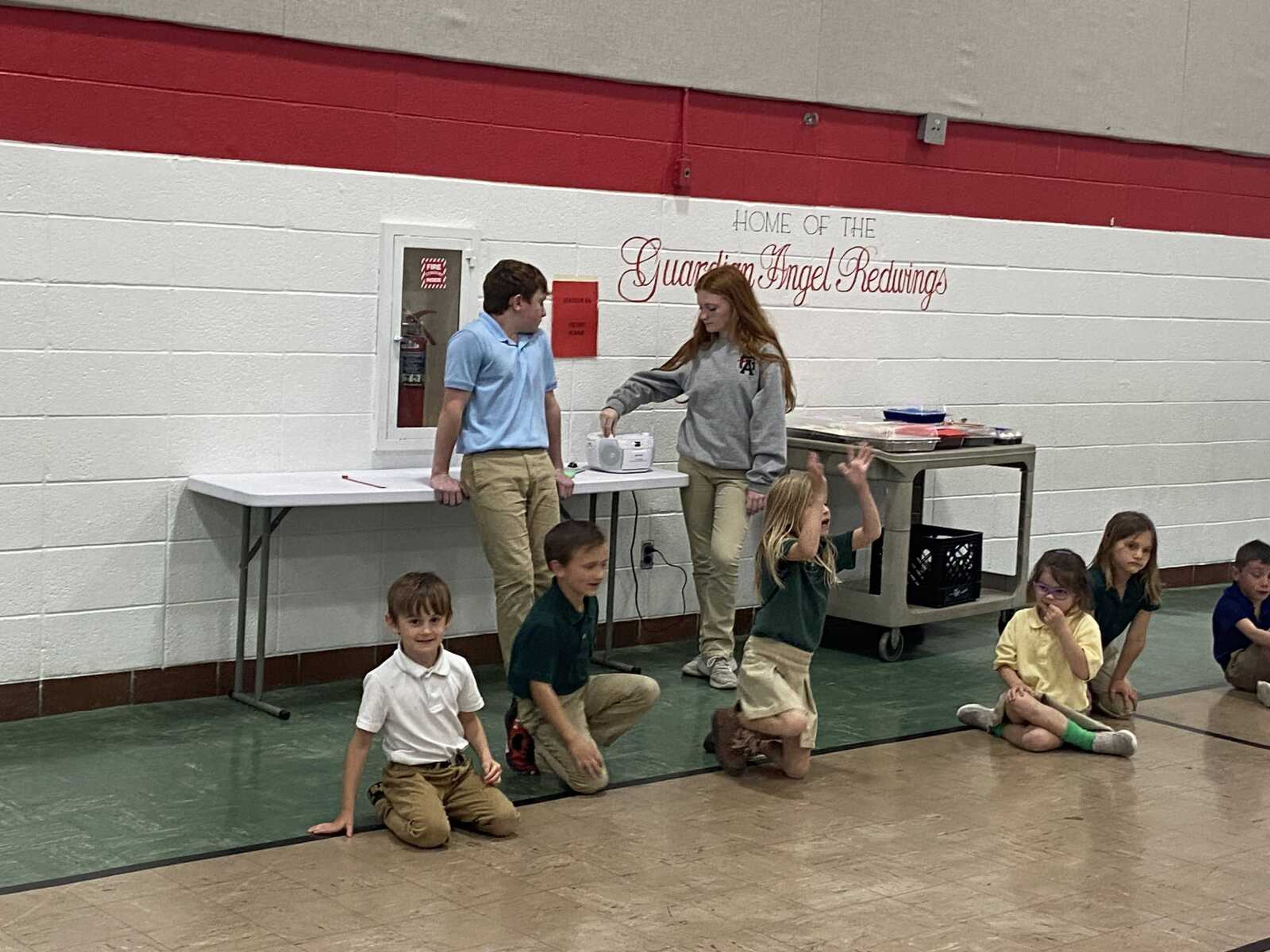 Eighth graders, Kasyn & Adisyn Seabaugh, ran the operation when it was time for the staff to do the cake walk.  The kindergarten students clapped & encouraged the staff as they walked.
