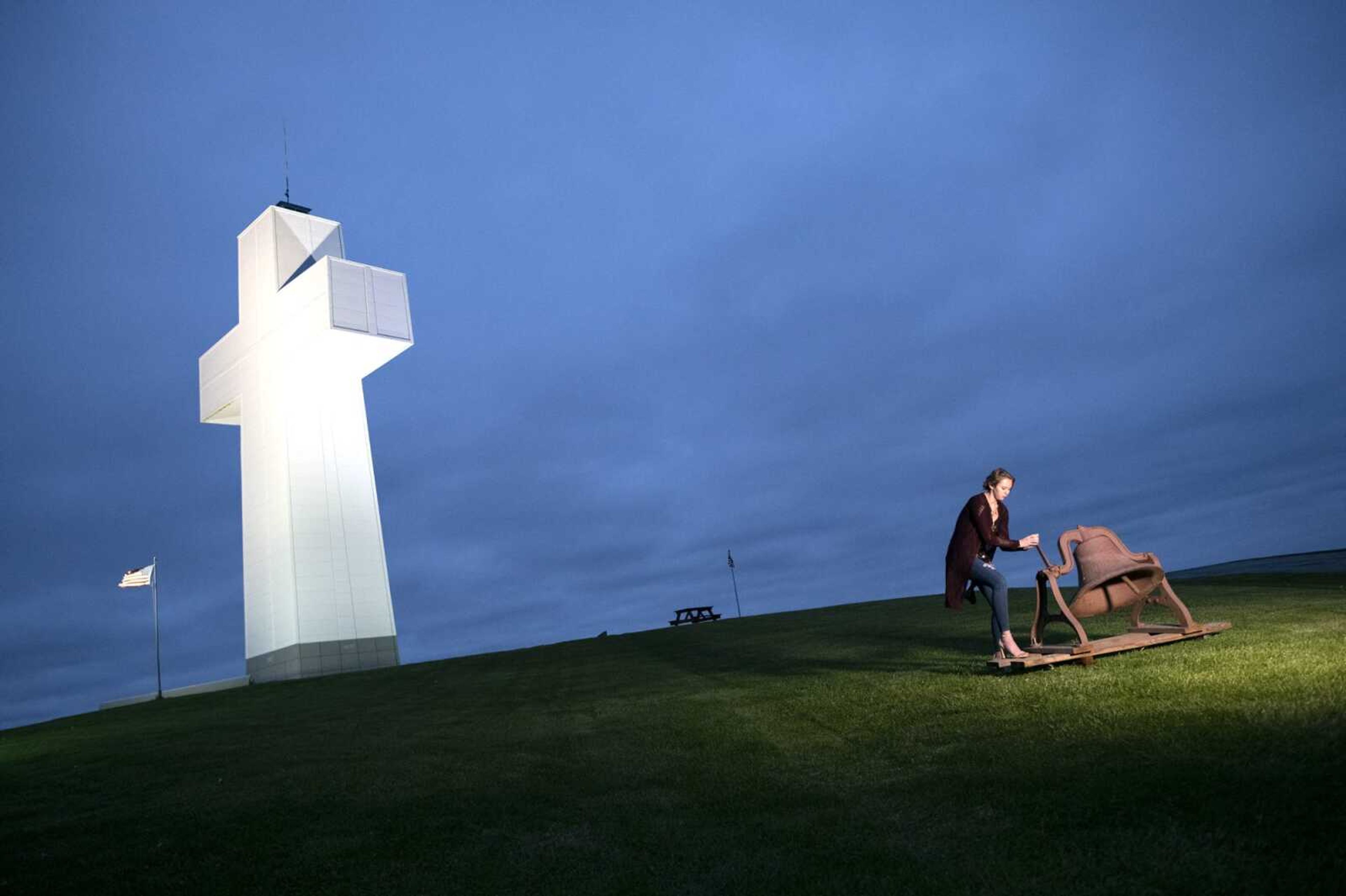 Victoria Bittle, 17, of Cobden, Illinois, rings a bell at the beginning of the annual Easter sunrise service Sunday, April 12, 2020, at Bald Knob Cross of Peace in Alto Pass, Illinois. Worshipers flock to the cross most years for the service, but not during the COVID-19 pandemic. However, there were a few people at the cross to conduct the service and share it with the masses. Teresa Gilbert, executive director of Bald Knob Cross of Peace said WSIL-TV livestreamed and broadcast the service.