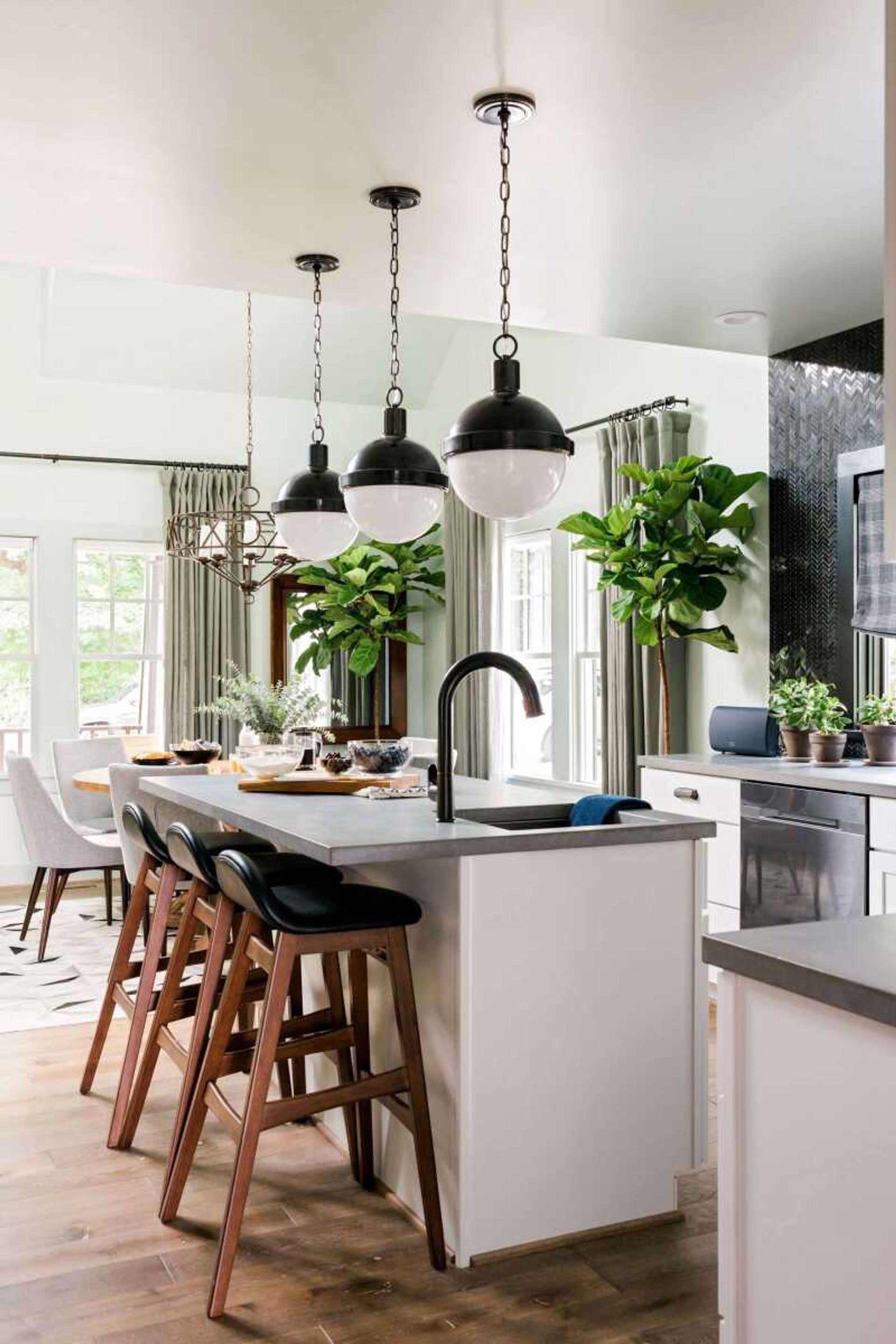 This undated photo provided by HGTV, shows a portion of a kitchen in Ann Arbor, Mich. Concrete countertops, as shown here in the HGTV Urban Oasis 2016 kitchen designed by Brian Patrick Flynn, are very popular right now, yet their classic modern look isn t likely to go out of style anytime soon, says Flynn. (HGTV/Scripps Networks, LLC. Via AP)