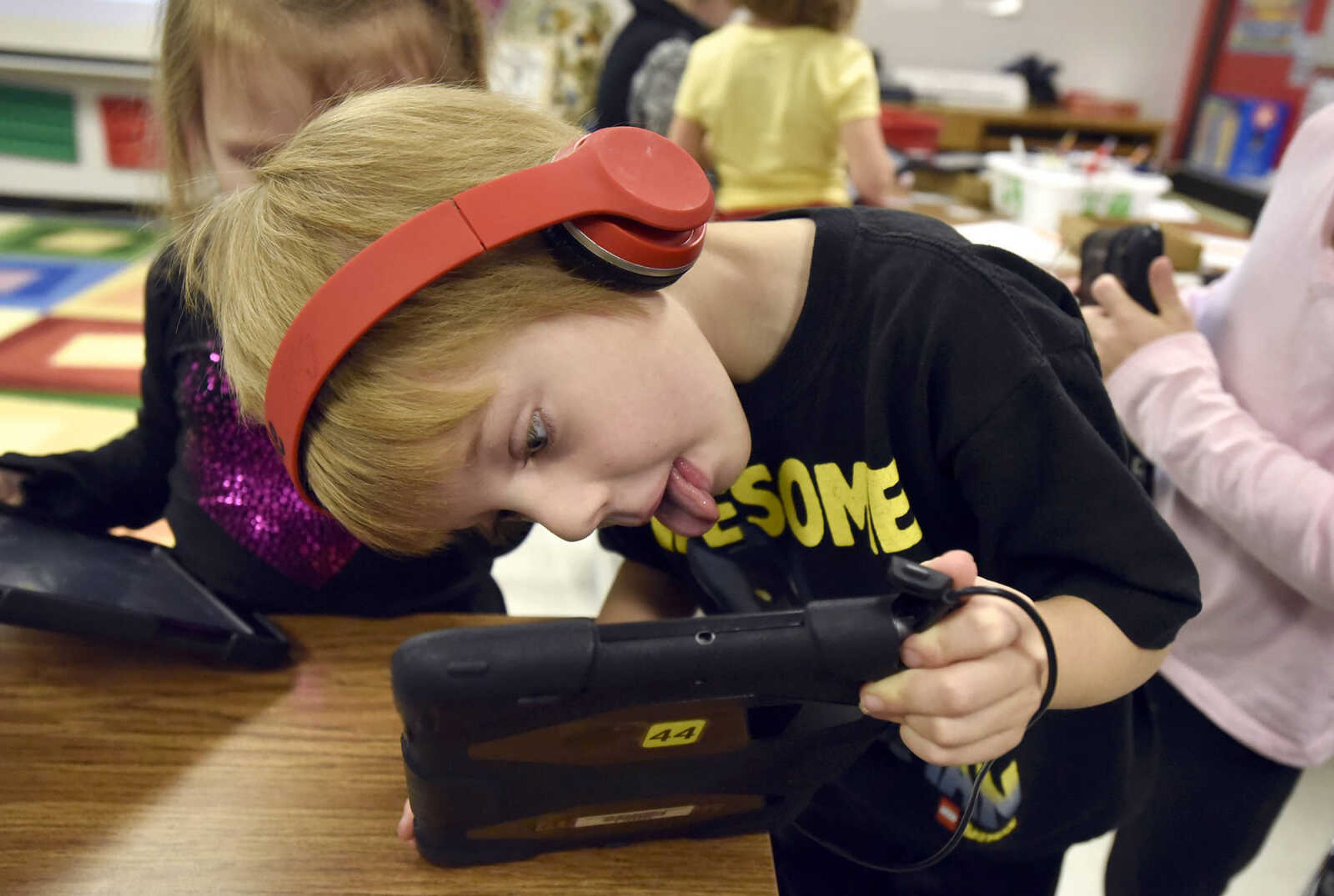 Cole Kasten takes a silly selfie on his iPad on Friday, Jan. 6, 2016, in Jennie Pehle's kindergarten class at Orchard Drive Elementary in Jackson.