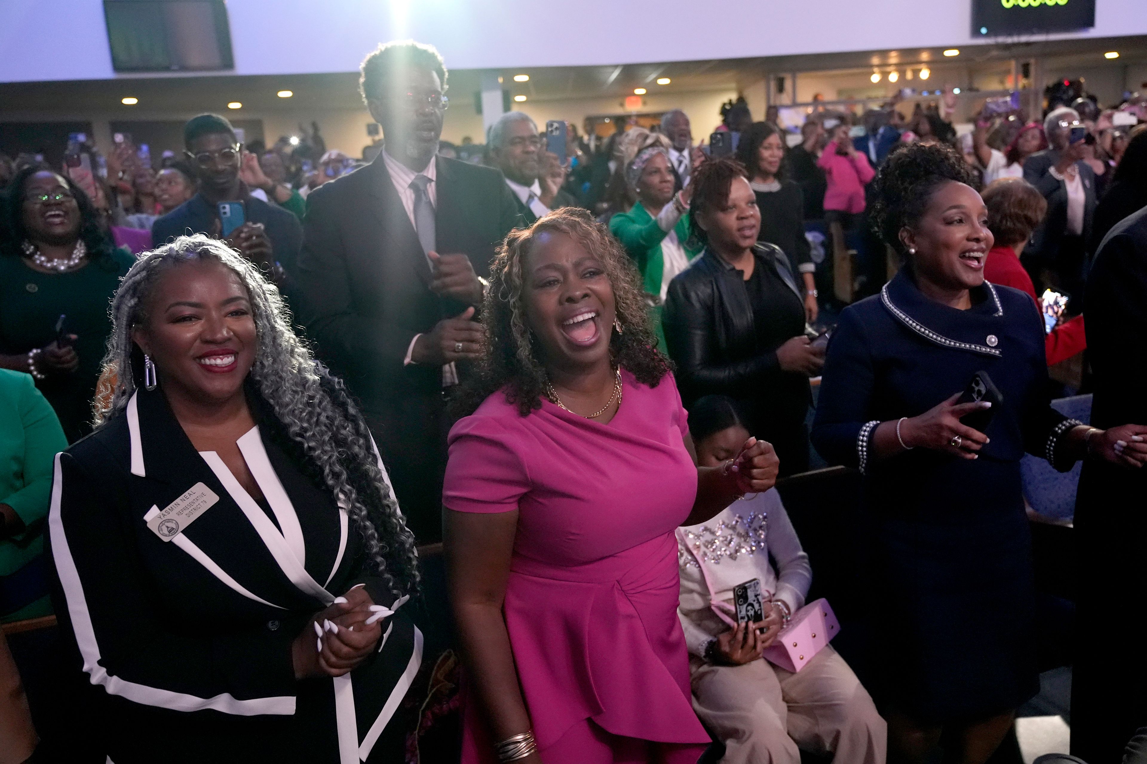 Attendees sing "Happy Birthday" as Stevie Wonder performs for Democratic presidential nominee Vice President Kamala Harris' birthday during a church service and early vote event at Divine Faith Ministries International, Sunday, Oct. 20, 2024, in Jonesboro, Ga. (AP Photo/Jacquelyn Martin)