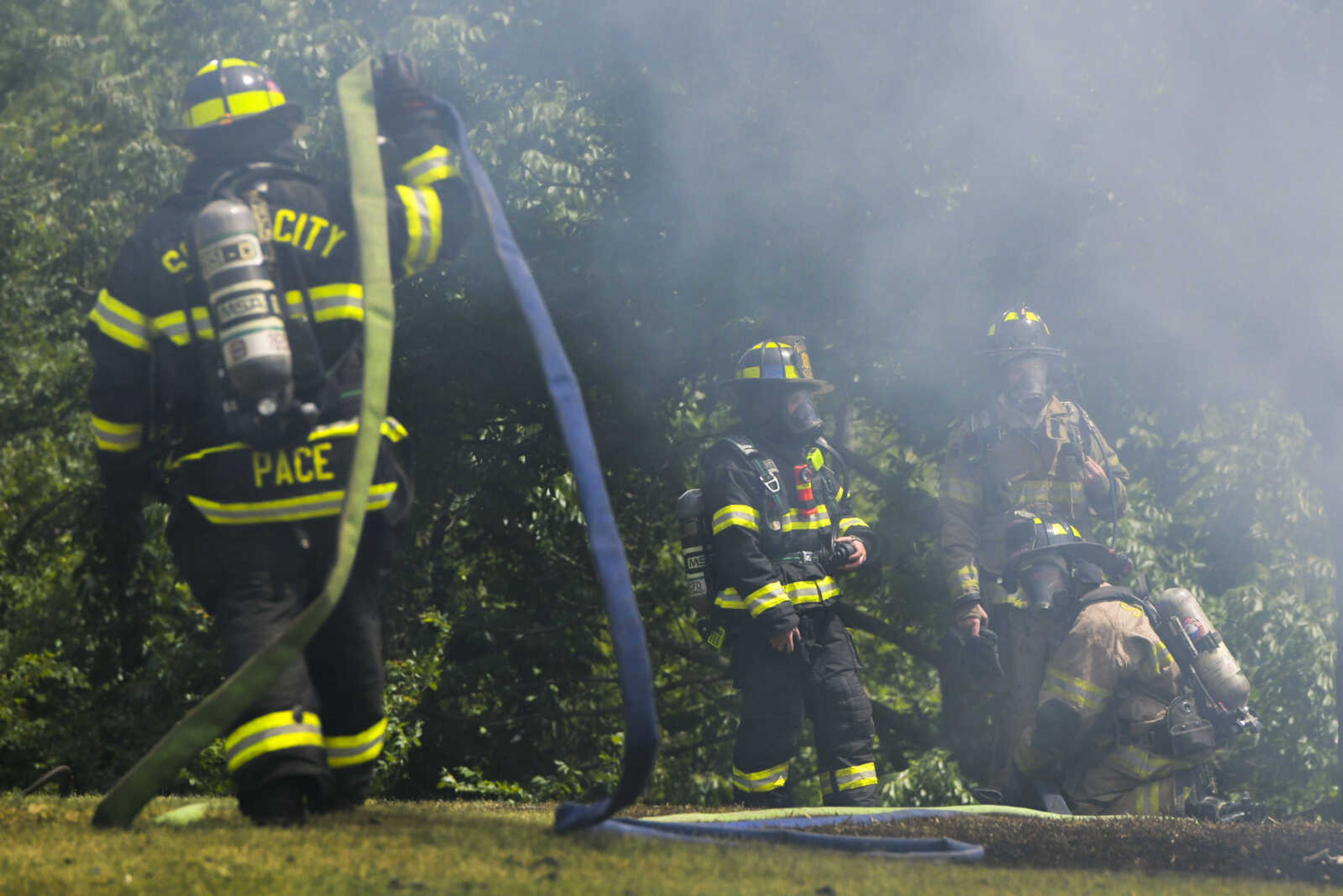 Members of the NBC Fire Protection District receive mutual aid from the Oran Fire Protection District, the Scott City Fire Department, the Scott County Rural Fire Protection District and the Scott County Sheriff's Office during a working fire Thursday, June 25, 2020, in the 300 block of Lake Road in Scott County between U.S. Highway 61 and Interstate 55.