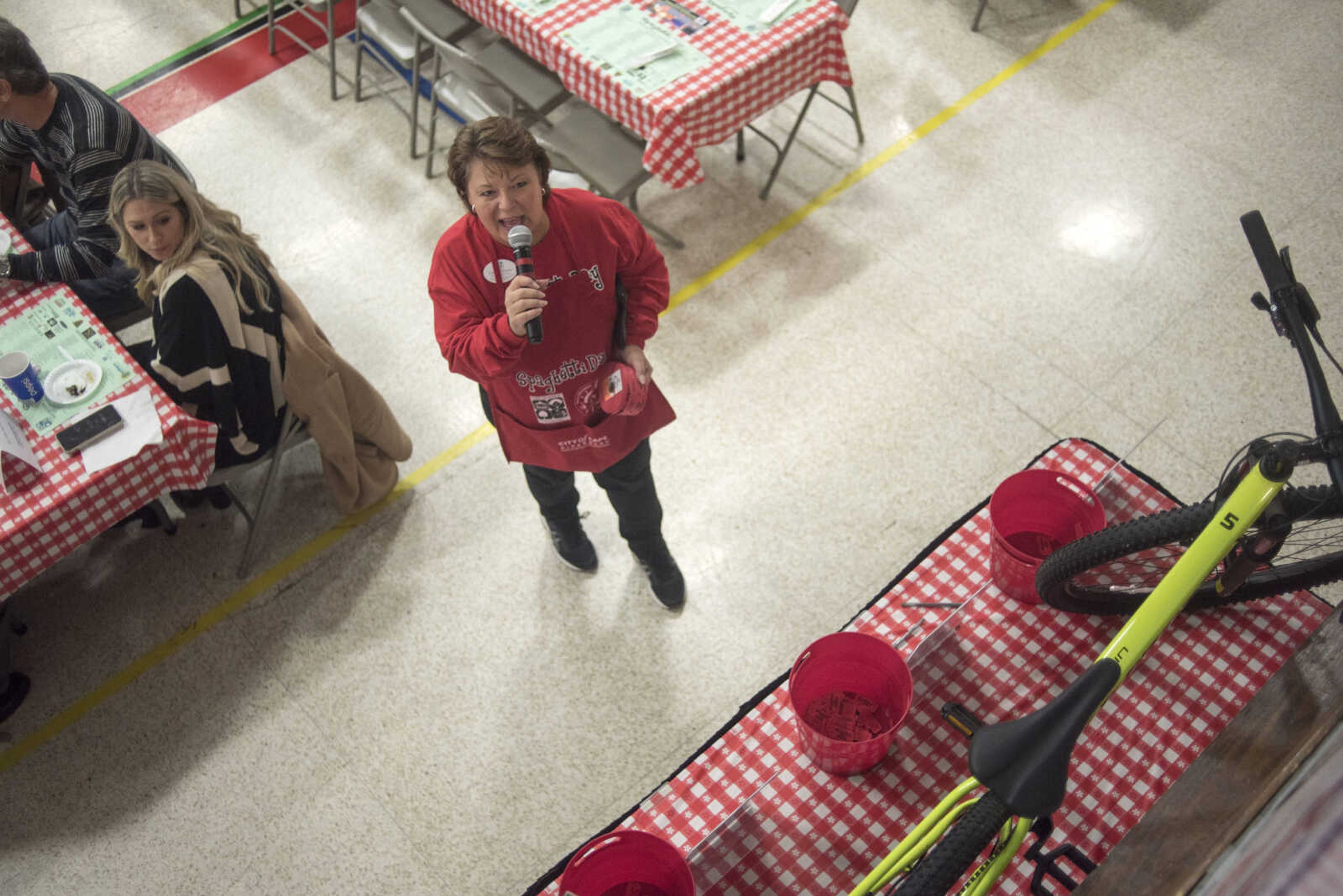 Penny Williams announces raffle prizes during the Parks & Recreation Foundation's Spaghetti Day Thursday, Nov. 7, 2019, at the A.C. Brase Arena building in Cape Girardeau.