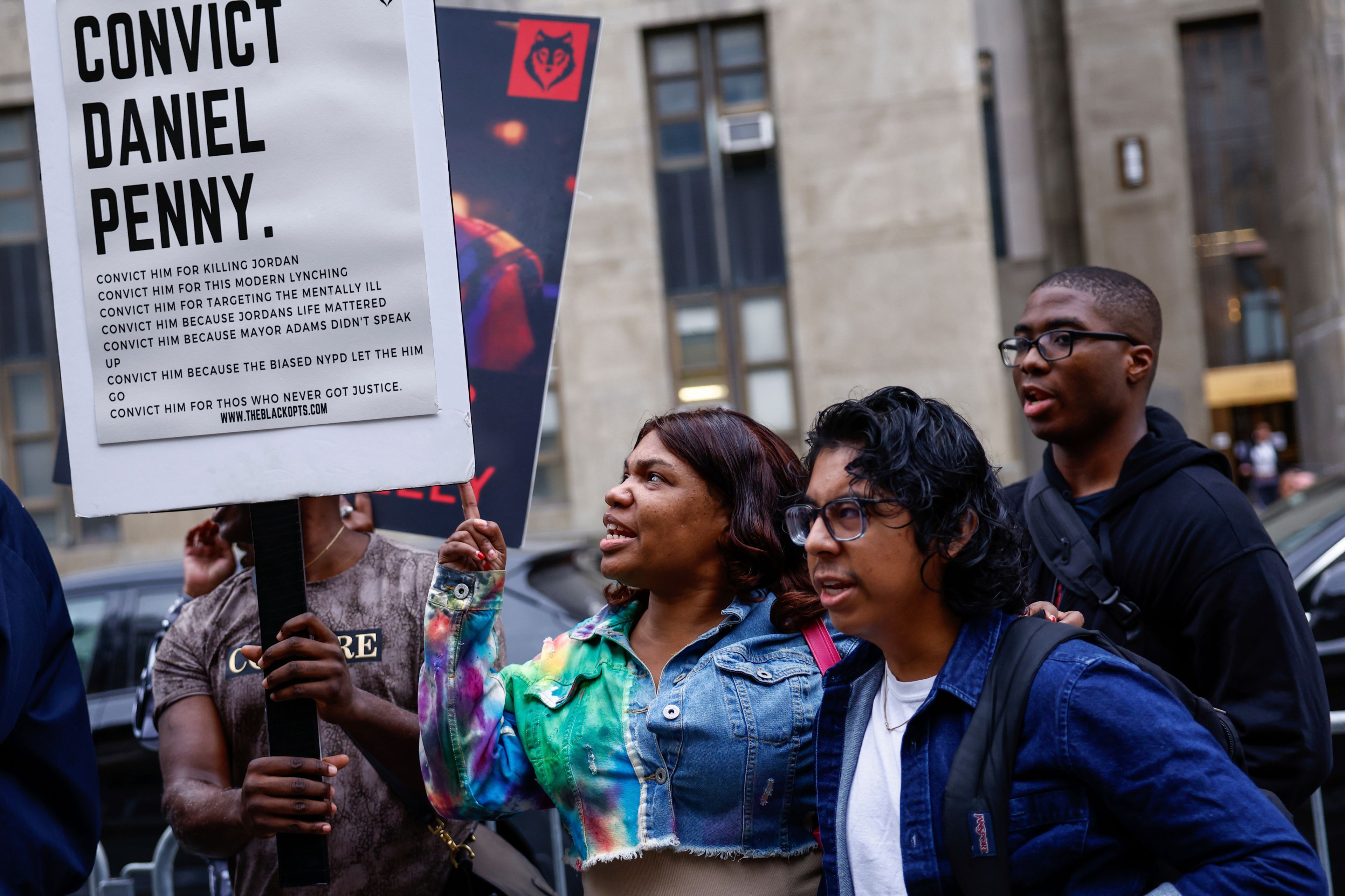 Protestors gather before Daniel Penny, the white veteran accused of choking a distressed Black subway rider to death, arrives for opening statements at the court in New York, Friday, Nov. 1, 2024.(AP Photo/Kena Betancur)