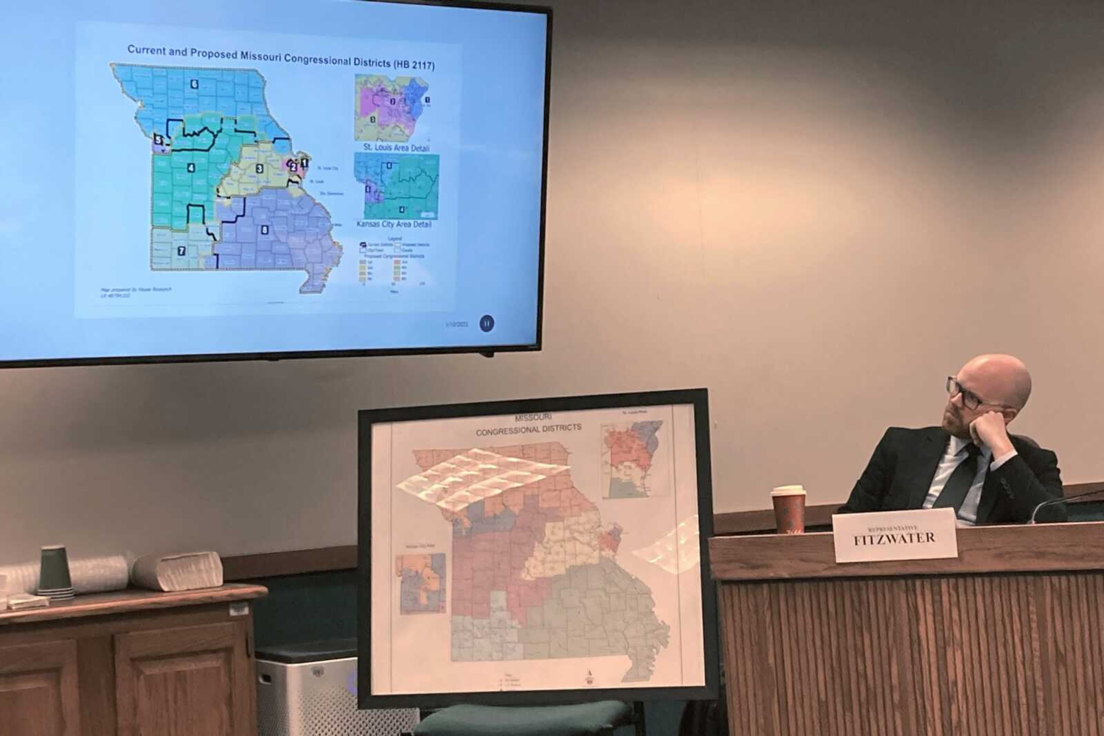 Missouri state Rep. Travis Fitzwater studies a proposed map of U.S. House districts during a state House committee hearing Jan. 10 at the state Capitol in Jefferson City, Missouri. With the state's Republican-led Legislature still deadlocked on redistricting, Missouri now faces lawsuits in both federal and state court asking the judiciary to intervene and order a new U.S. House map before this summer's primary election.