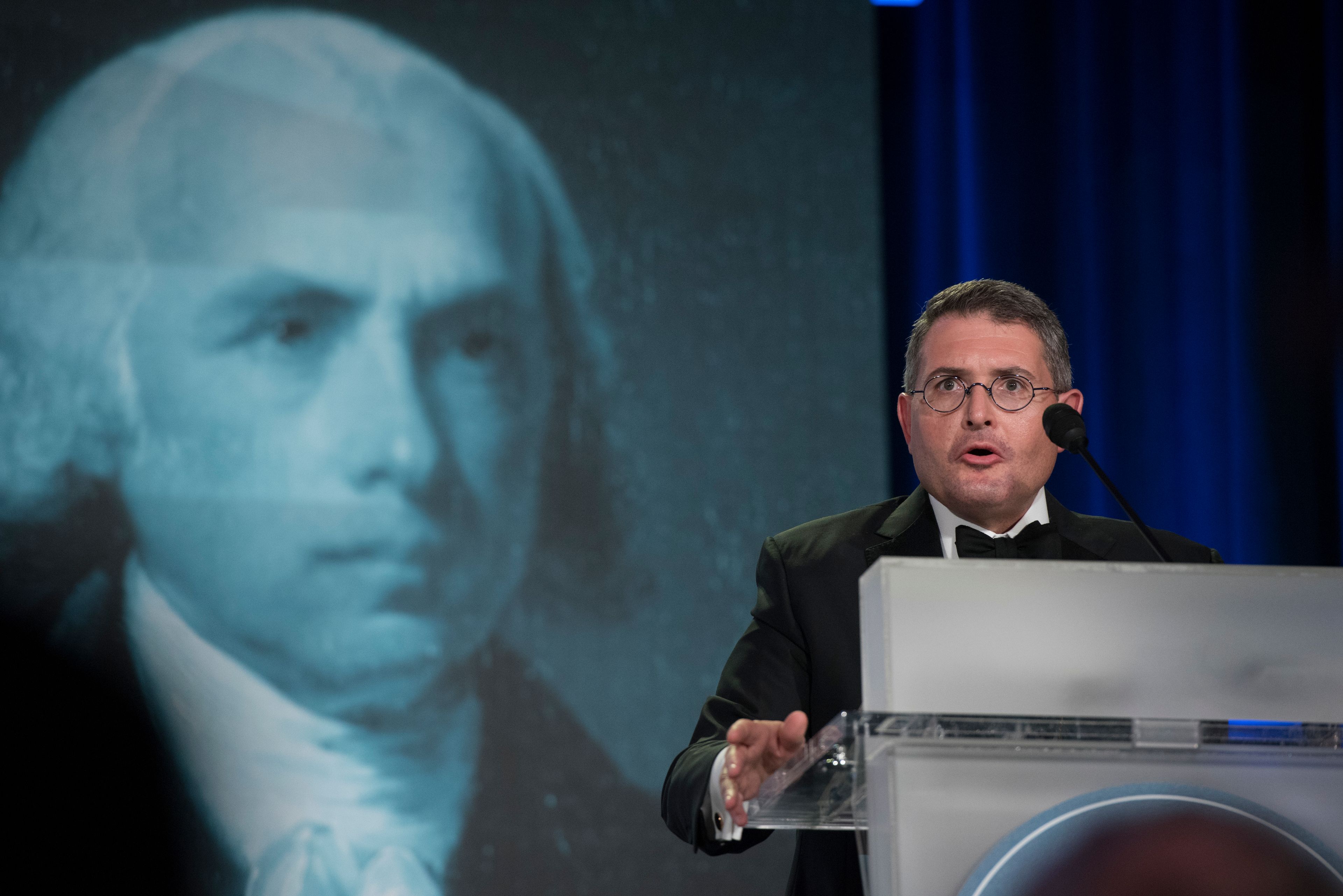 FILE - An image of former President James Madison is seen behind Leonard Leo, as he speaks at the National Lawyers Convention in Washington, in this Nov. 16, 2017 file photo. (AP Photo/Sait Serkan Gurbuz, file)