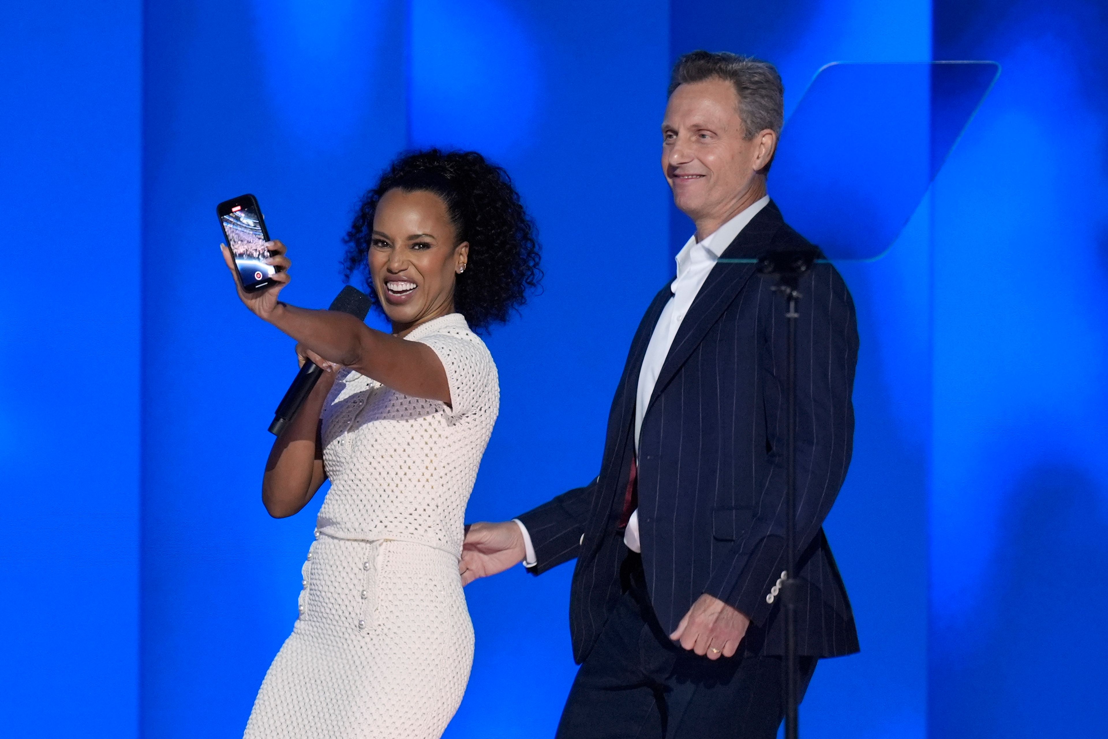 Kerry Washington, left, and Tony Goldwyn appear on stage during the Democratic National Convention Thursday, Aug. 22, 2024, in Chicago. (AP Photo/J. Scott Applewhite)