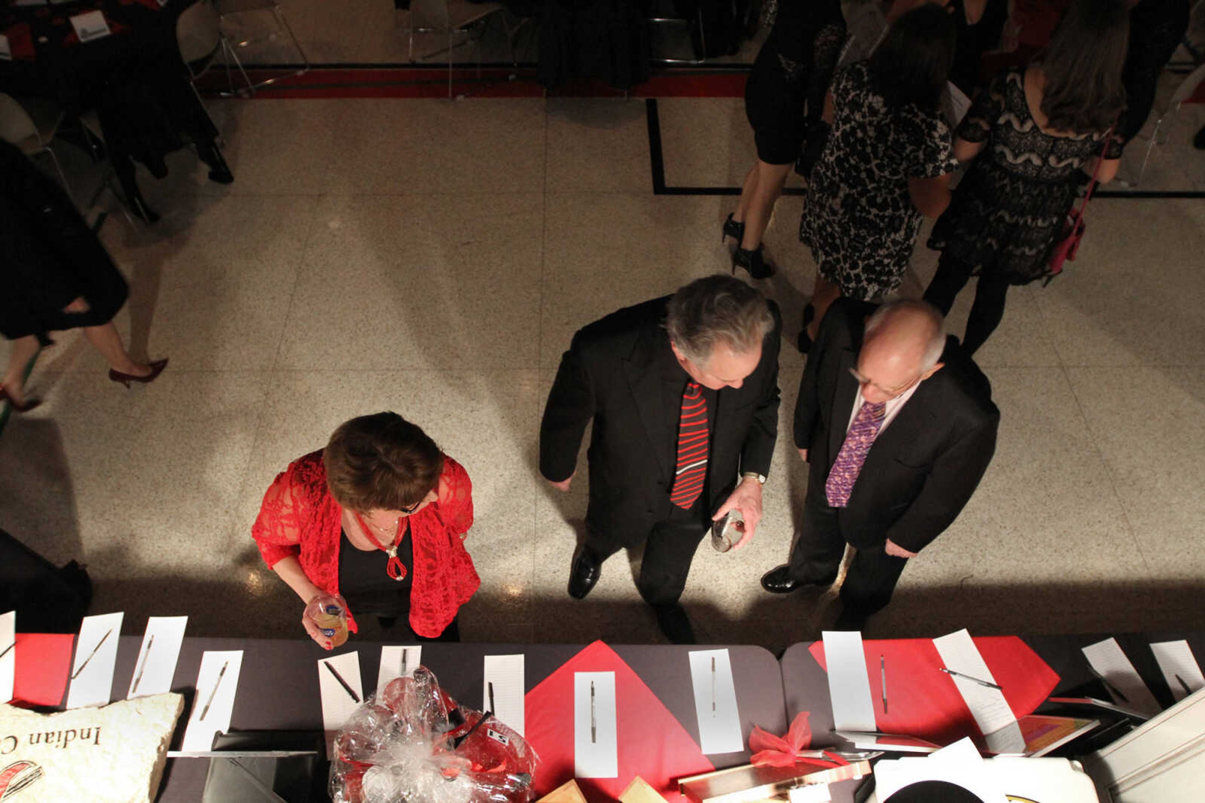 GLENN LANDBERG ~ glandberg@semissourian.com


Patrons look over the silent auction table during the Red and Black Affair benefit for the Jackson R-2 Foundation Saturday, Feb. 7, 2015 at the Arena Building.