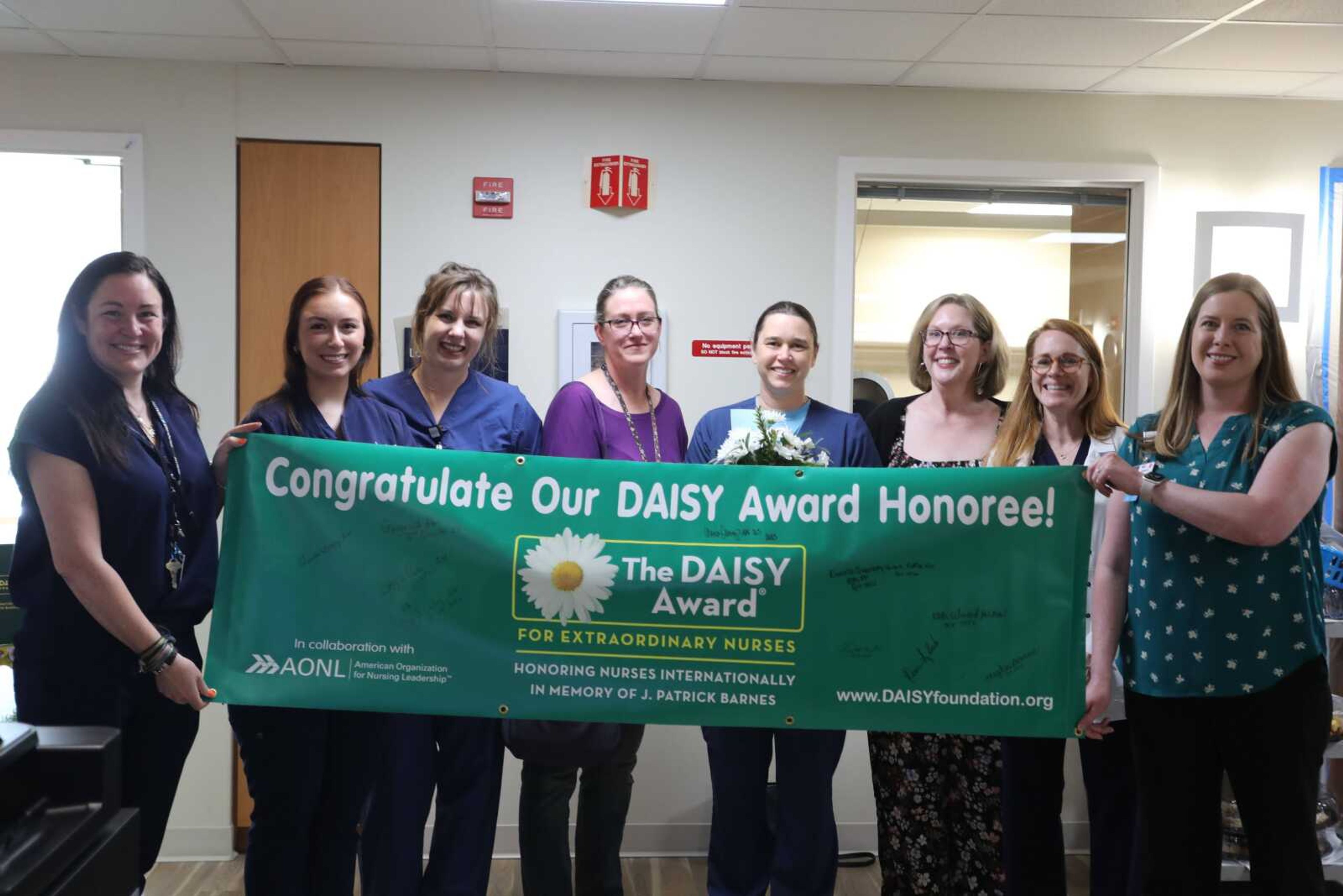 Fauquier Health DAISY committee, along with Toni Maxwell, Chief Nursing Officer and Rebecca Segal, CEO recognize Myra Griffin.