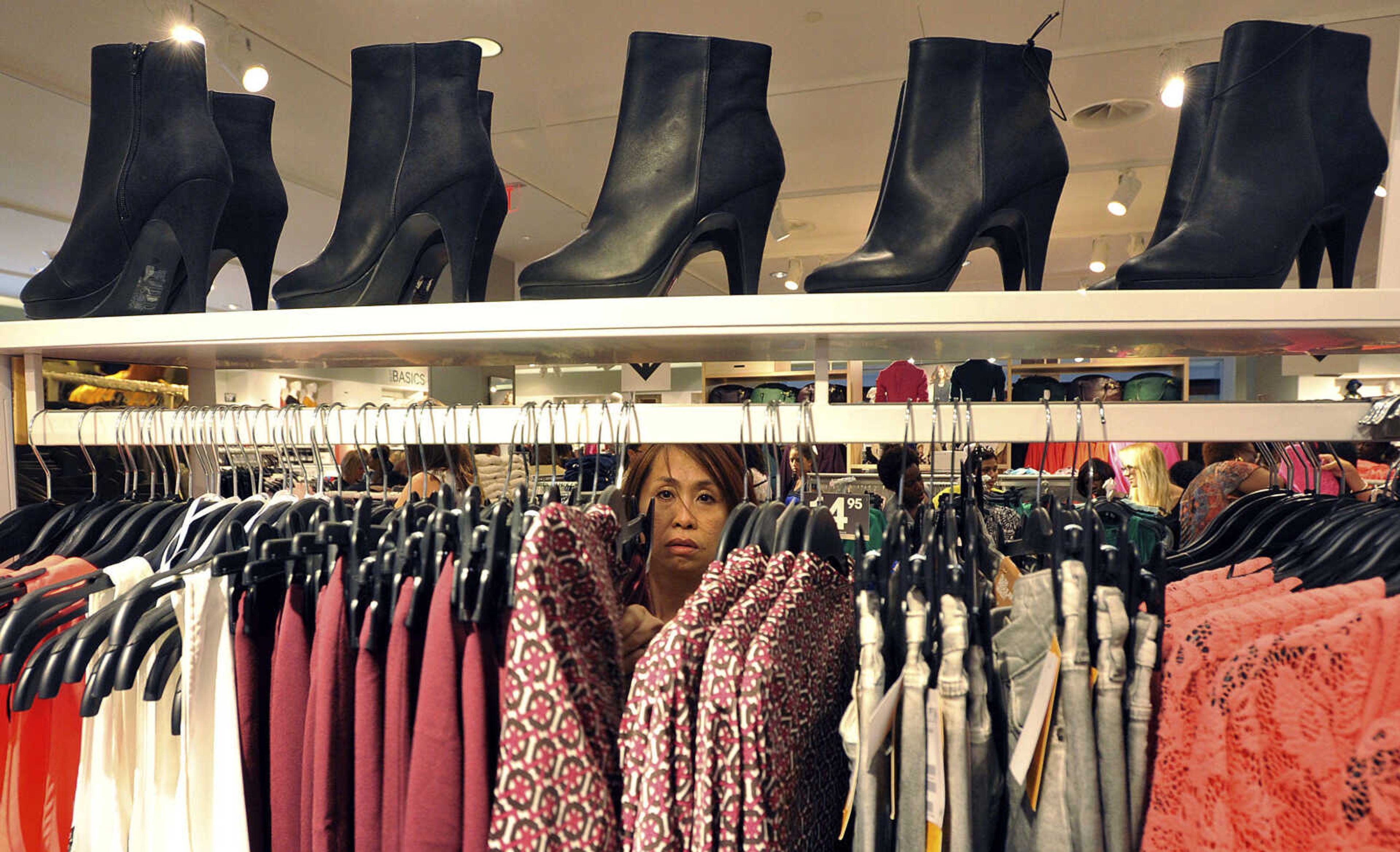 FILE - In this Thursday, Sept. 6, 2012, photo, a woman shops at The Avenues Mall in Jacksonville, Fla. Economists say the gains in retail sales in August and September could bring stronger economic growth for the second half of the year. The government reported today that retail sales rose 1.1 percent in September following a revised 1.2 percent increase in August. They're the biggest gains since October of 2010.  (AP Photo/Florida Times-Union, Bruce Lipsky, File)