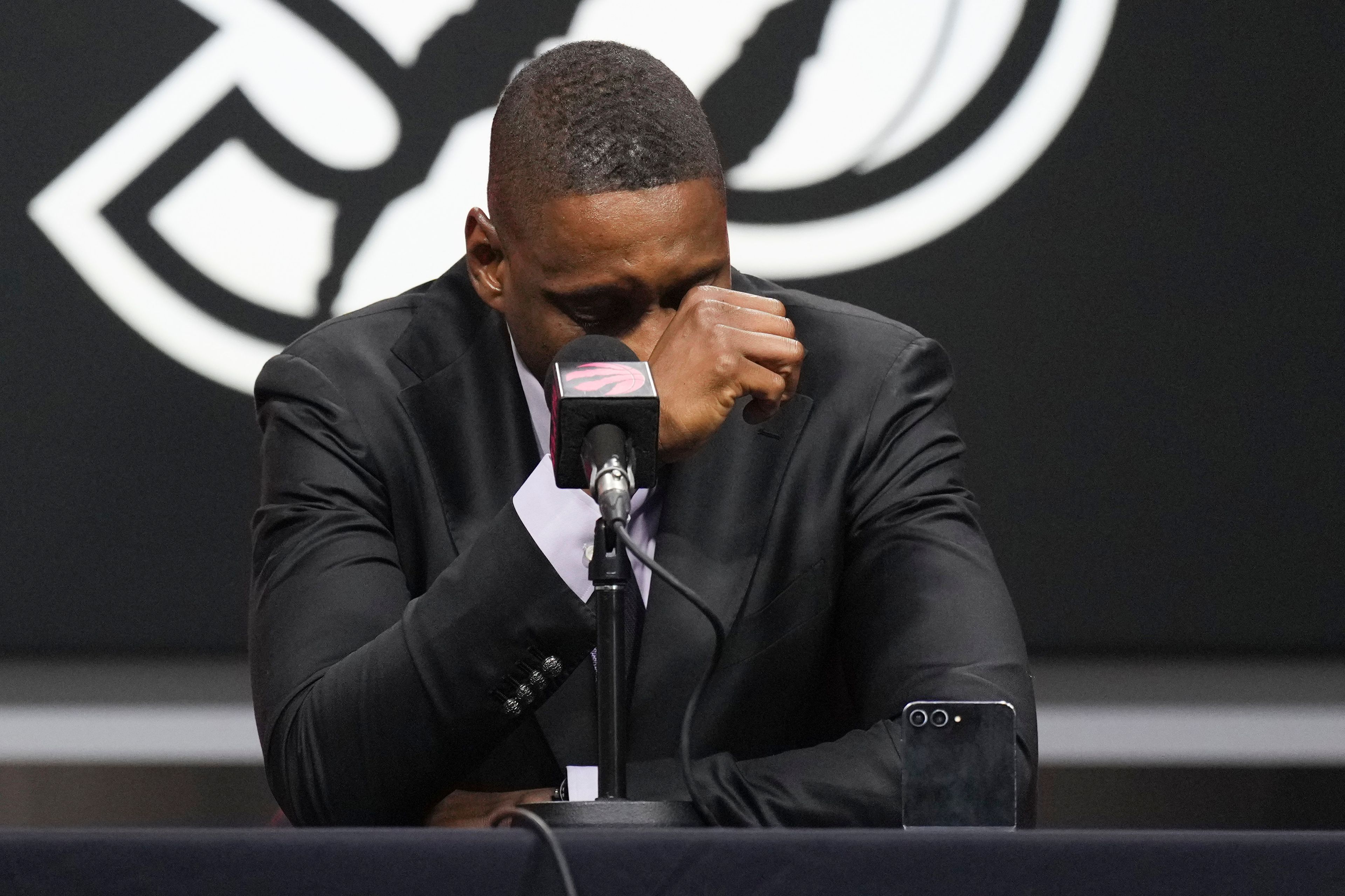 Toronto Raptors President Masai Ujiri is overcome with emotion speaking about Dikembe Mutombo, who died Monday from brain cancer, in Toronto, Monday, Sept. 30, 2024. (Chris Young/The Canadian Press via AP)