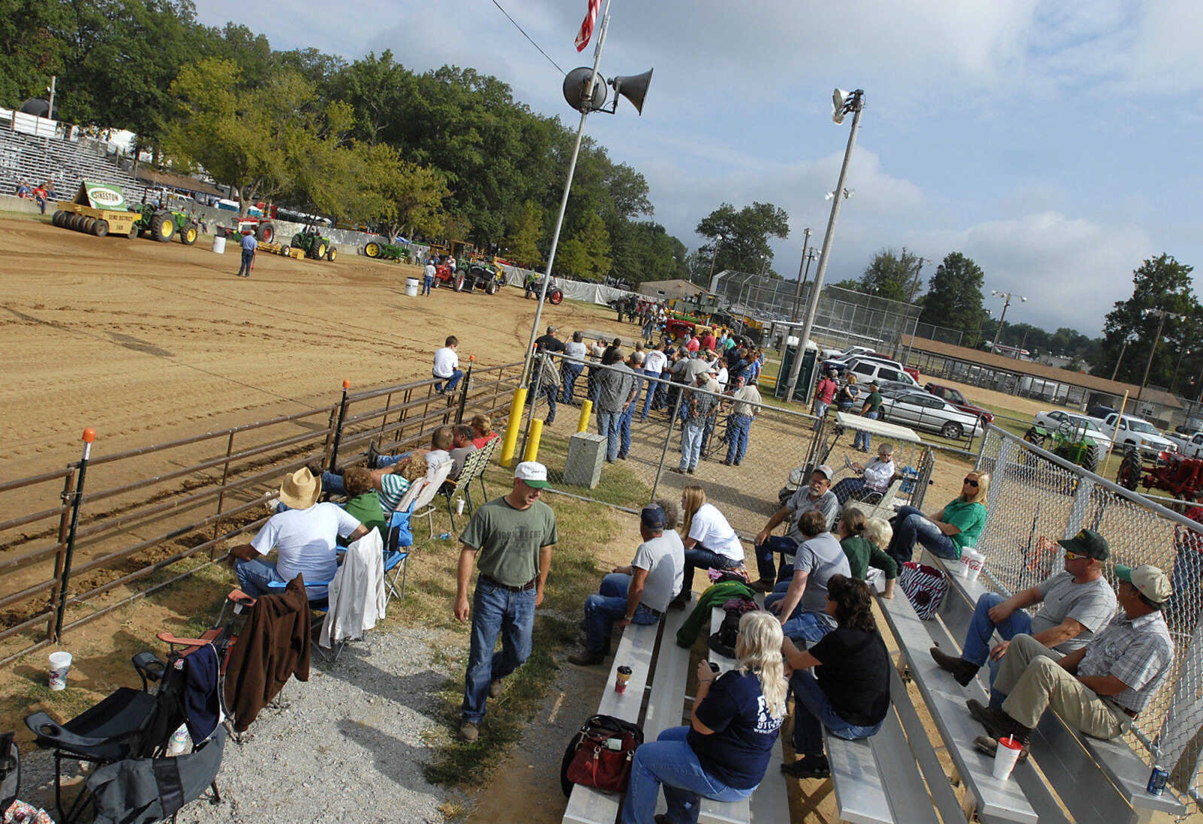 KRISTIN EBERTS ~ keberts@semissourian.com

Spectators watch the antique tractor pull put on by the Egypt Mills Antique Tractor Club at the SEMO District Fair on Saturday, Sept. 10, 2011.