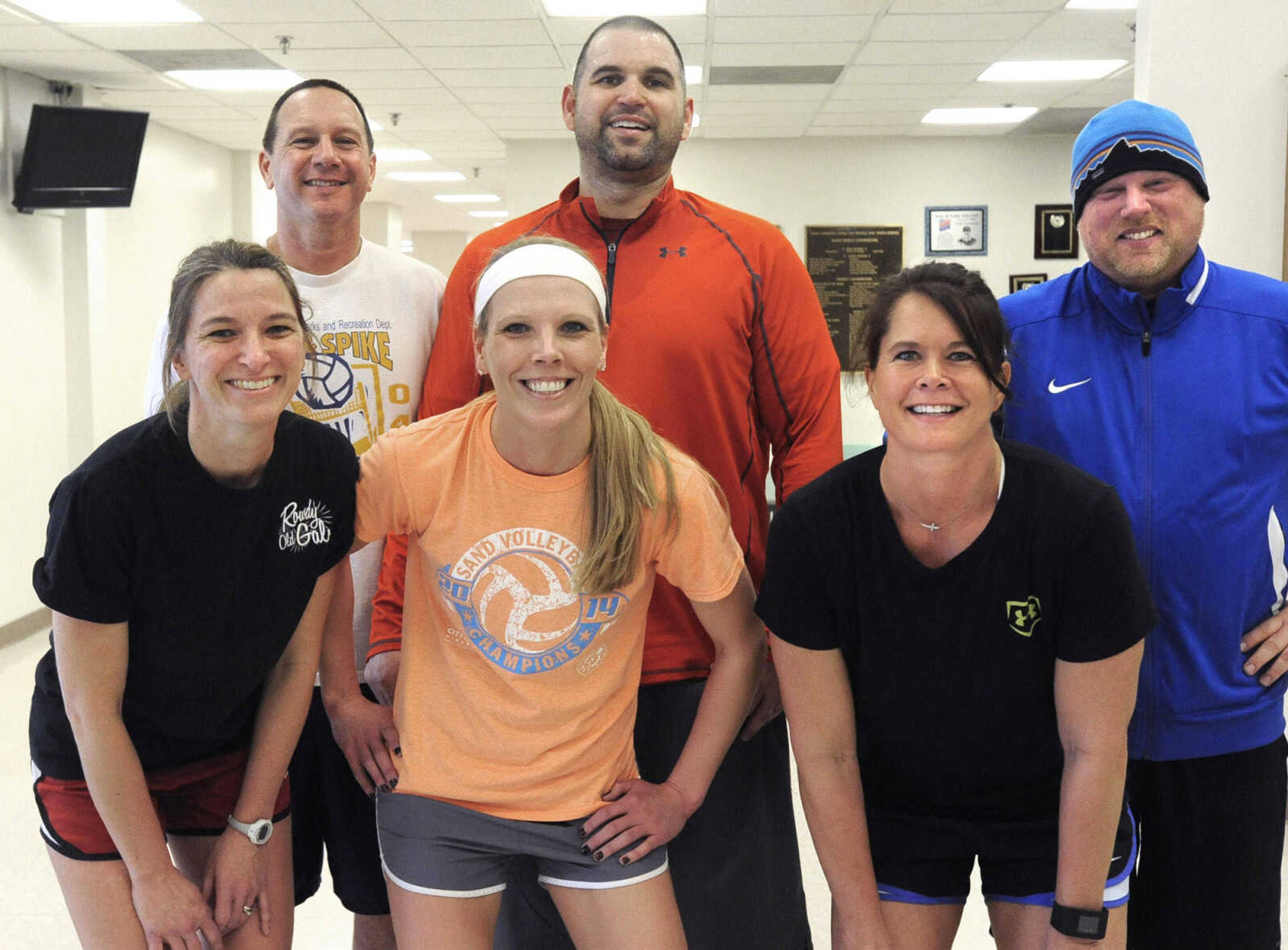 Members of the Dead Frogs pose for a photo, from left, front: Kristi Boles, Julie Brandmeyer, Melisa Hicks; back: Sam Castleman, Josh Stephens and Shaun McClintock at the Osage Invitational Co-ed Volleyball Tournament Sunday, March 1, 2015 at the Osage Centre.