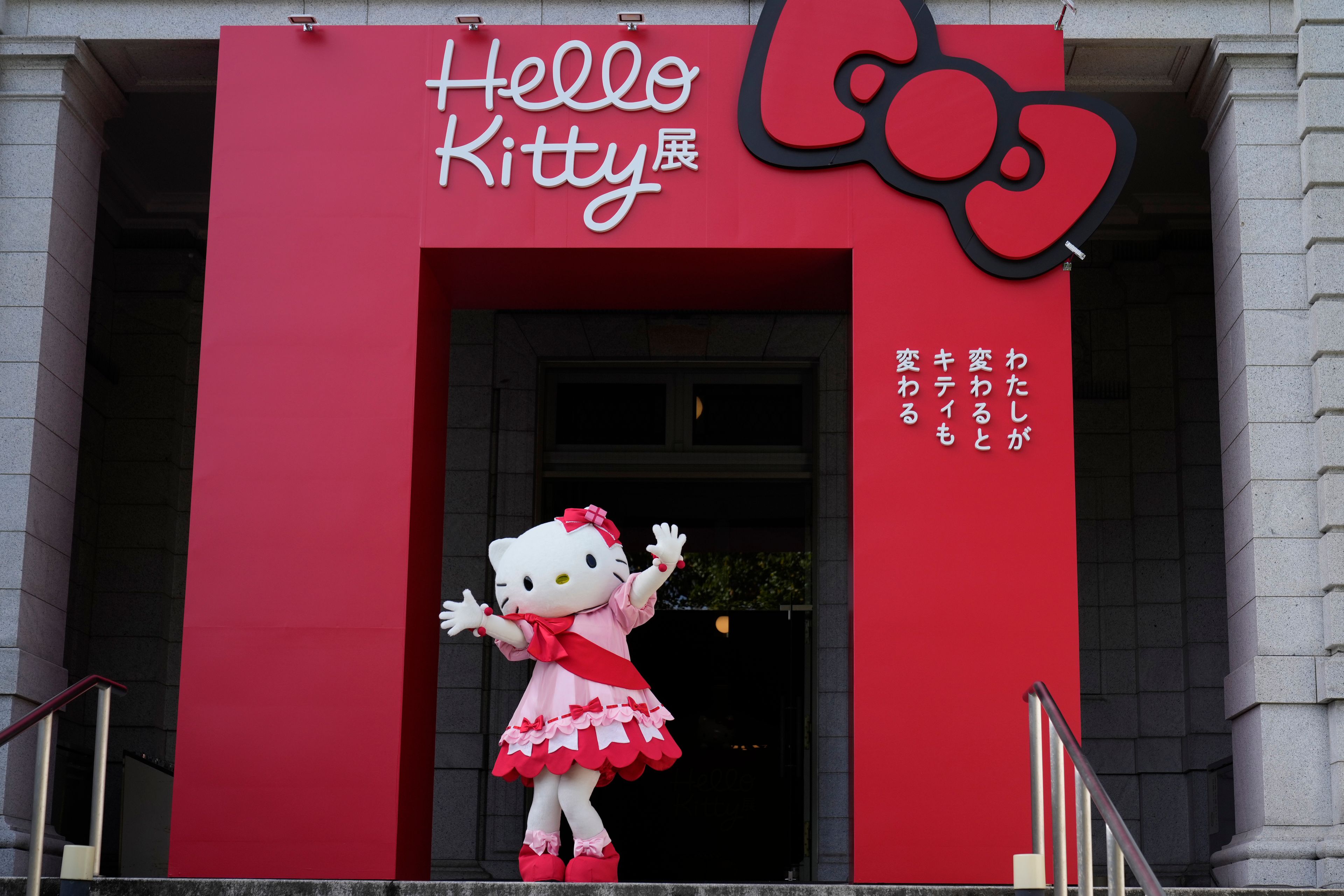 Hello Kitty waves as she appears to attend the opening ceremony of the exhibition "As I change, so does she," marking the 50th anniversary of Hello Kitty at the Tokyo National Museum in Tokyo Wednesday, Oct. 30, 2024. (AP Photo/Shuji Kajiyama)