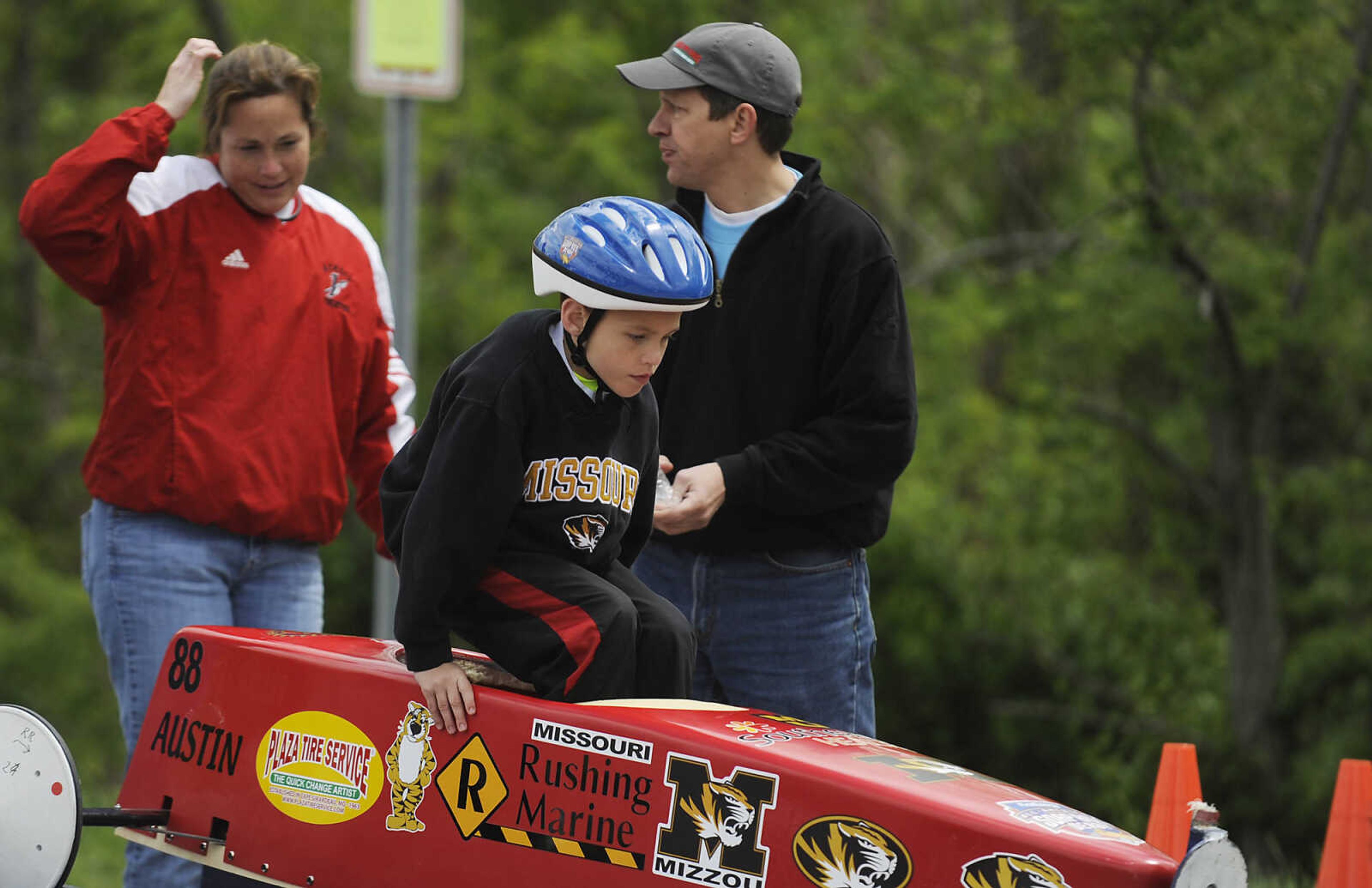 Austin Rushing, 7, climbs into his car during the 2013 Soap Box Derby Saturday, May 4, at Blanchard Elementary School, 1829 N. Sprigg St., in Cape Girardeau. Racers ranging in age from 7 to 17 competed in two divisions at the event which is a fundraiser for the Cape Girardeau Rotary Club. The winners in each division will go on to compete in the All-American Soap Box Derby held in Akron, Ohio in July.