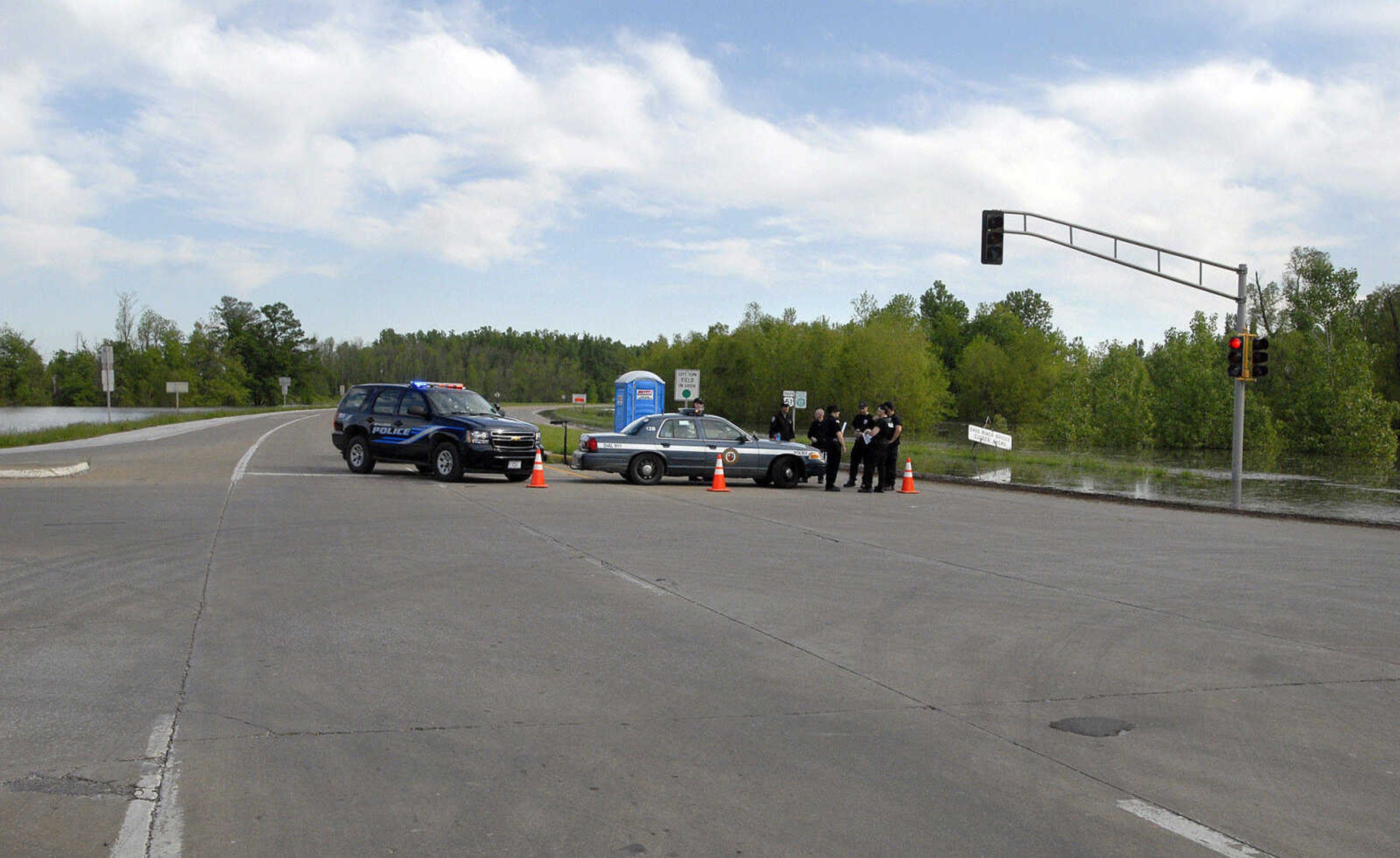 LAURA SIMON~lsimon@semissourian.com
Police officers block U.S. 51 approaching Cairo, Ill. Thursday, May 5, 2011. Only authorized people are allowed back inside the city until further notification.