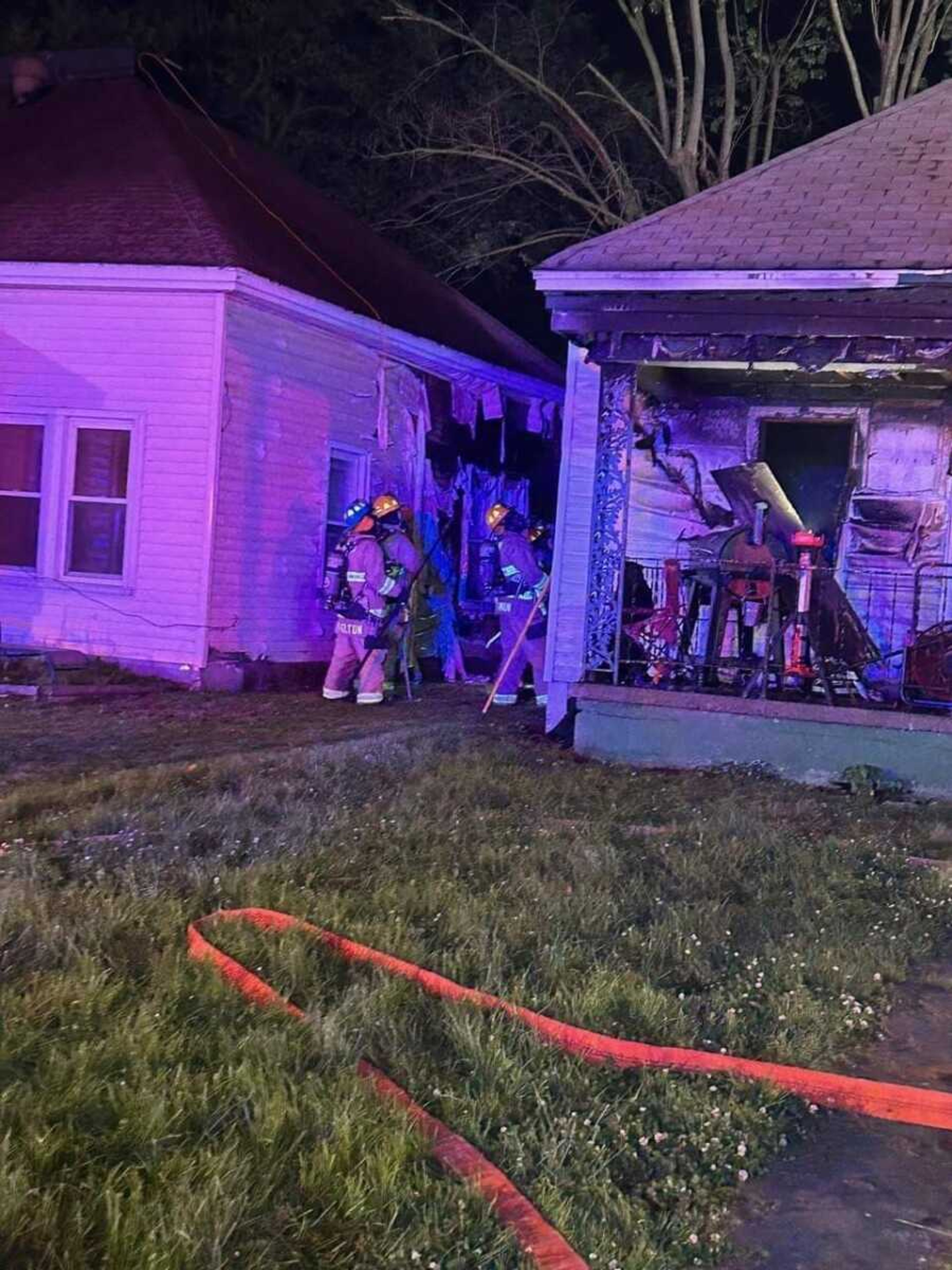 Firefighters battle a fire at the 300 block of West Missouri Boulevard in Scott City on Monday, May 6. A second home was damaged as flames shot out the west side of the building. No one was injured.