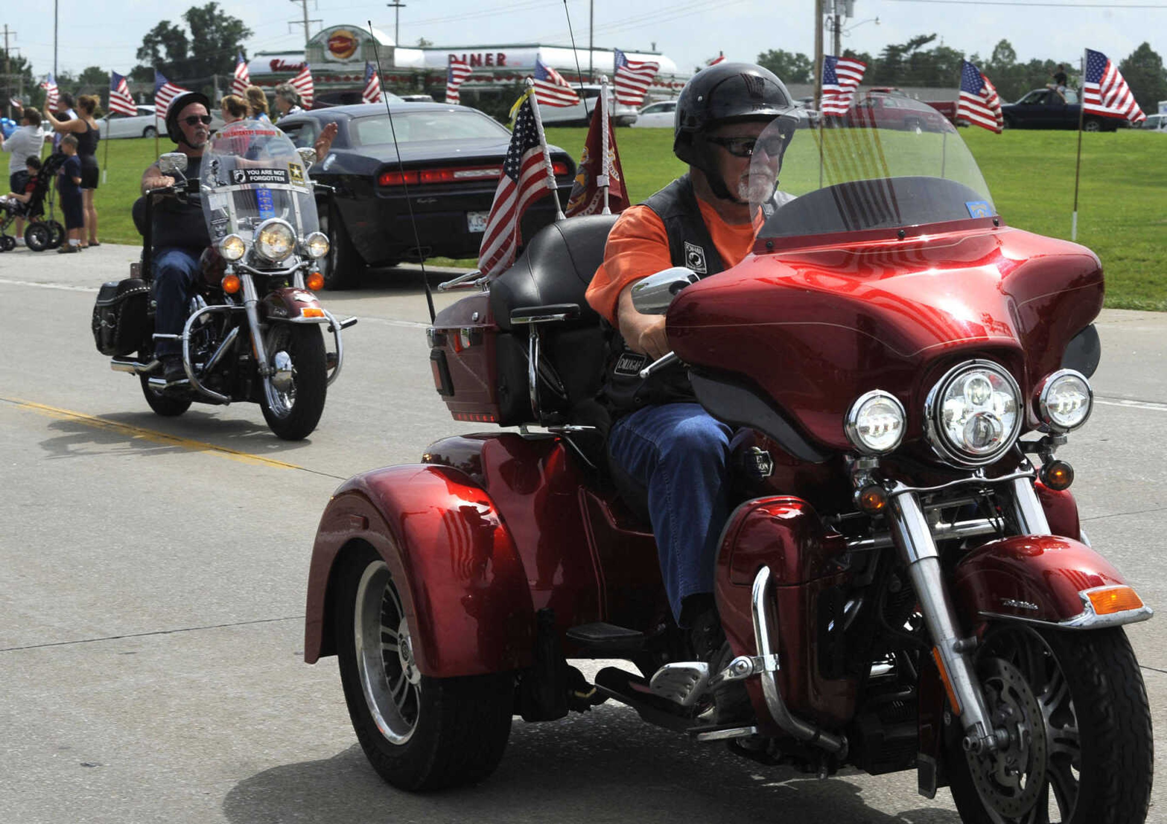 Motorcyclists ride with The Wall That Heals on Tuesday, June 17, 2014 in Perryville, Mo.