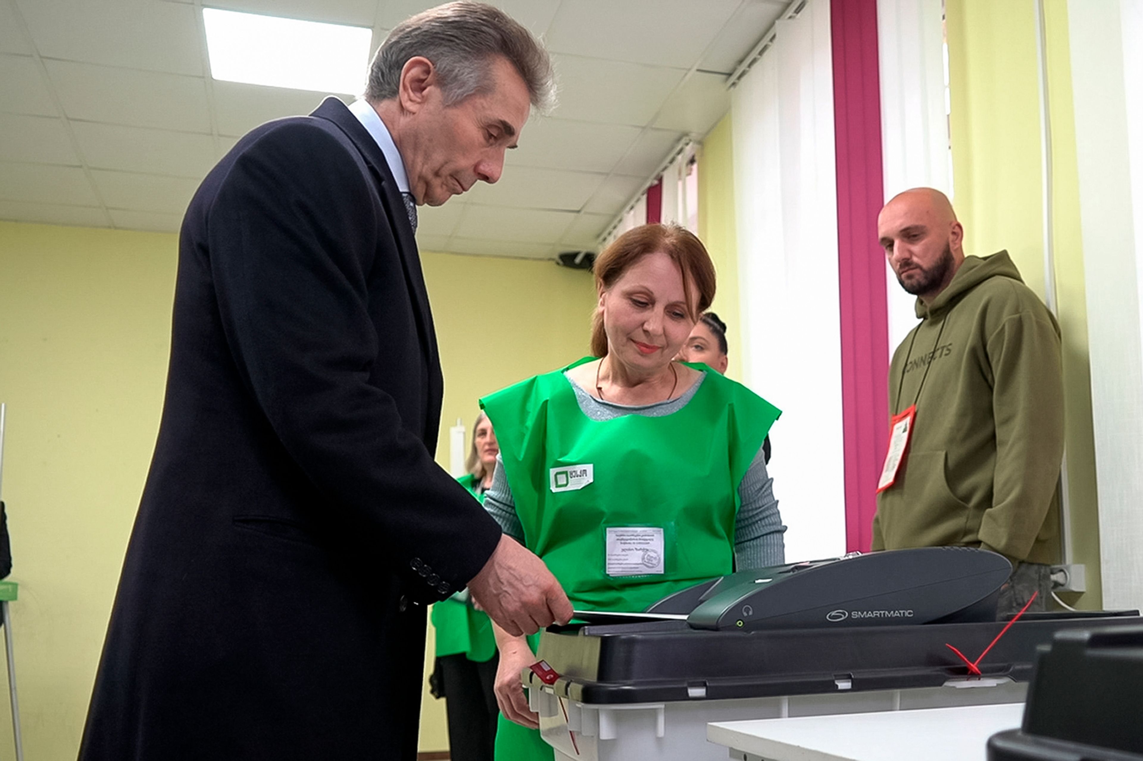 In this photo taken from video, Bidzina Ivanishvili, leader of the created by him the Georgian Dream party votes at a polling station during the parliamentary election in Tbilisi, Georgia, Saturday, Oct. 26, 2024. (AP Photo/Kostya Manenkov)