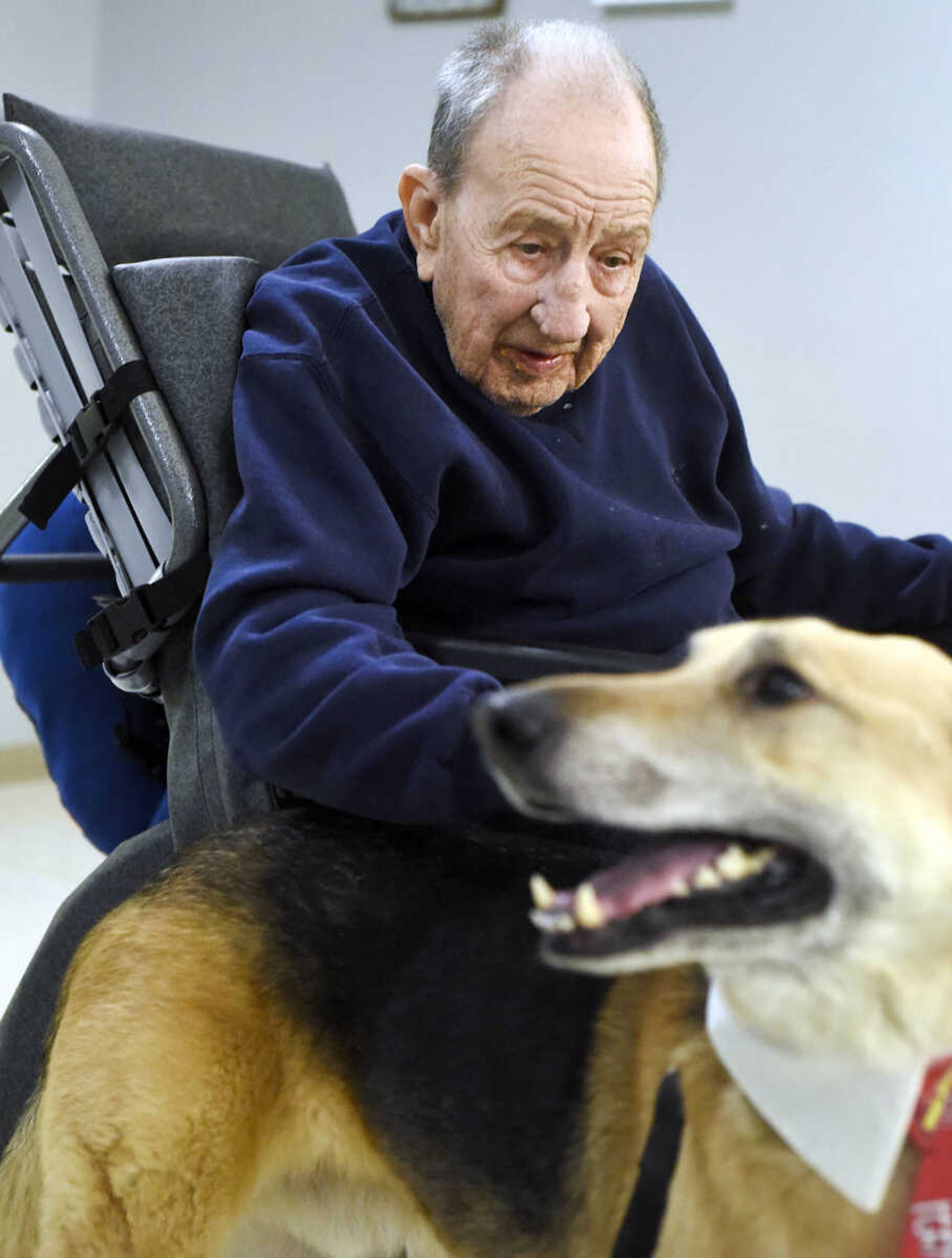 Ed Jaegers pets Max on Tuesday, Feb. 21, 2017, during the Pet Pals visit at the Missouri Veteran's Home in Cape Girardeau.