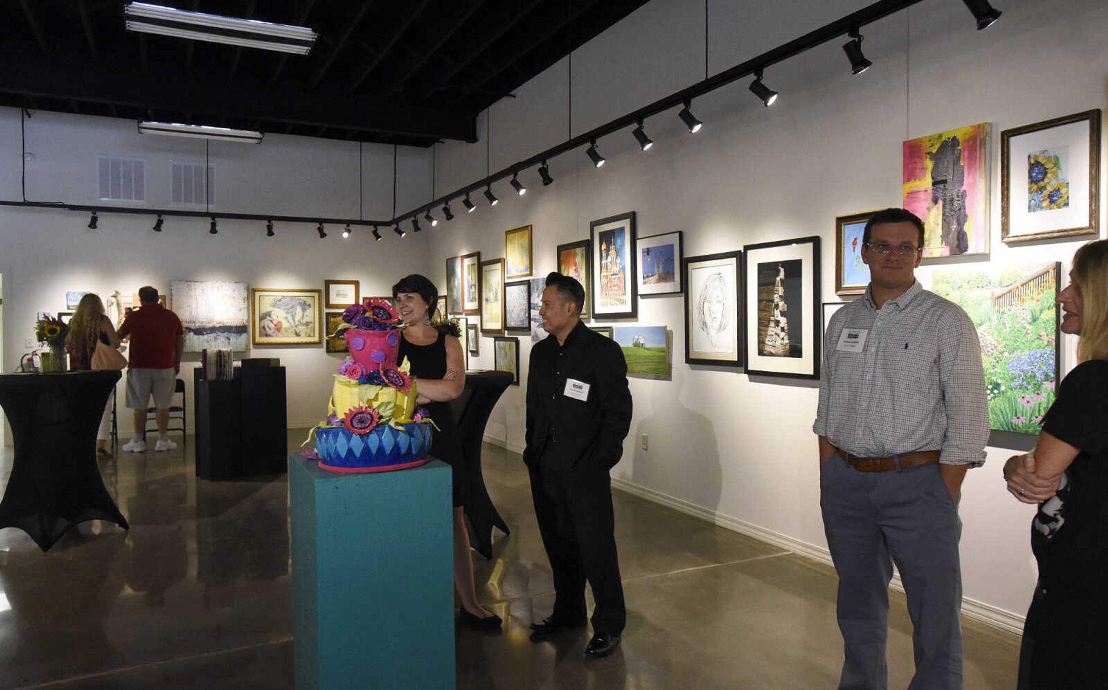 LAURA SIMON ~ lsimon@semissourian.com

People take in the grand opening reception for the 4th annual Members Exhibit at the Arts Council of Southeast Missouri in its new location at 16 North Main Street in downtown Cape Girardeau on Friday, Sept. 2, 2016.