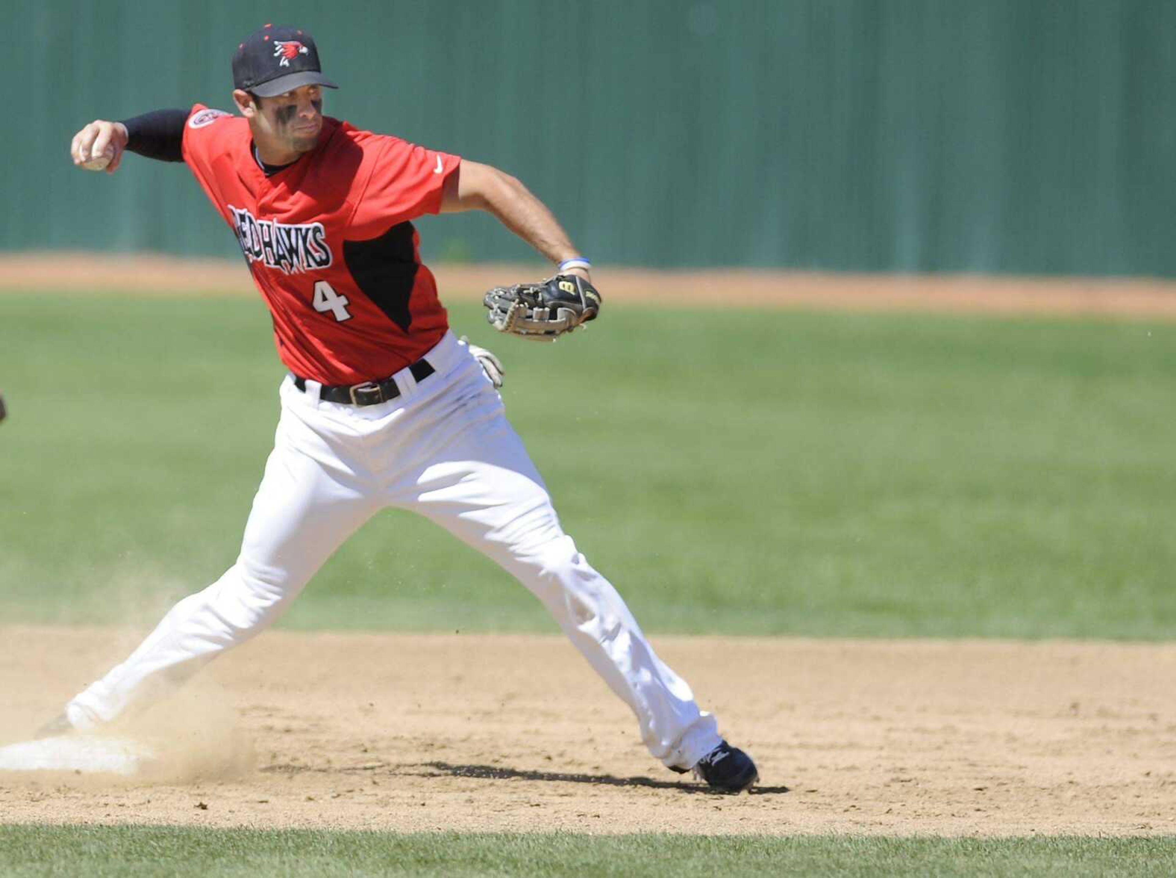 Southeast Missouri State shortstop Kenton Parmley throws out Eastern Kentucky's Richie Rodriguez at first to complete a double play during Friday's game at Capaha Field. Check out more photos from the game at semoball.com. (ADAM VOGLER)