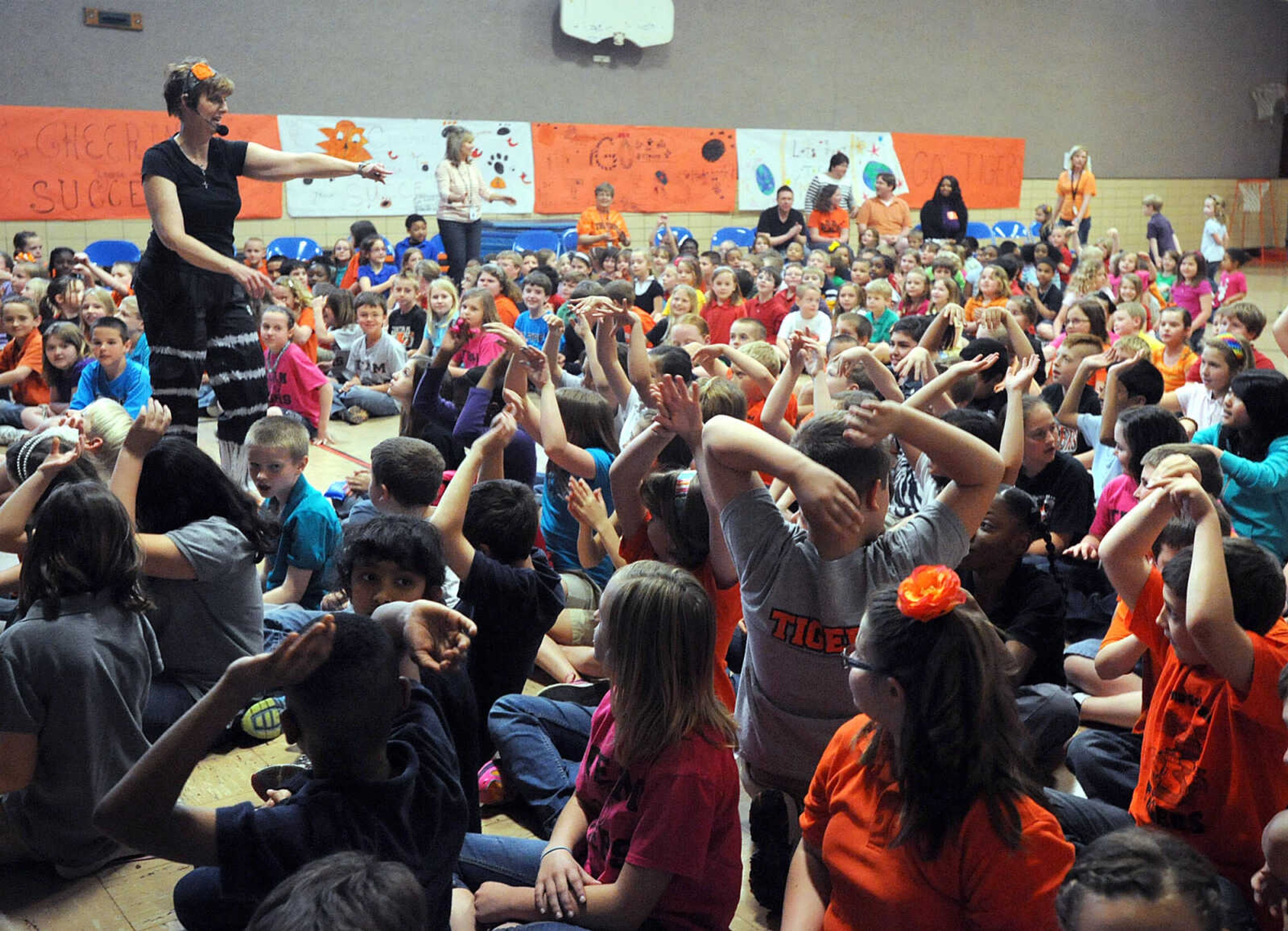 LAURA SIMON ~ lsimon@semissourian.com

Alma Schrader Elementary principal Ruth Ann Orr gets her students pumped up Monday, April 15, 2013 during the school's motivational pep rally in preparation for MAP testing.