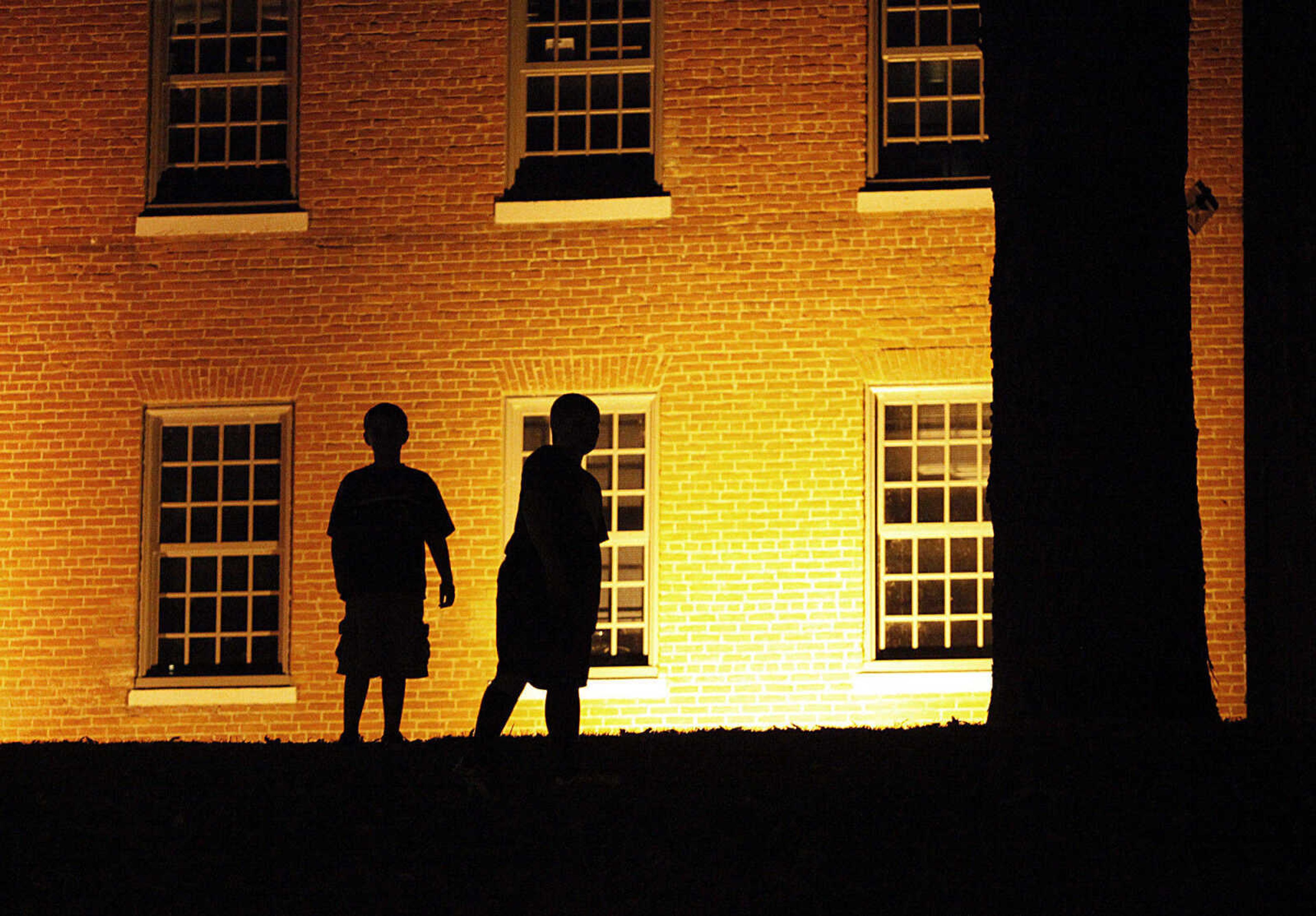 CHRIS MACKLER ~ photos@semissourian.com

Children listen to storyteller Jennifer Armstrong near the Old Seminary Building during the Ghost Storytelling Festival held on the east lawn of Southeast Missouri State University's River Campus in Cape Girardeau on Friday, Oct. 15, 2010. According to Chuck Martin, Executive Director of the Cape Girardeau Convention and Visitors Bureau, around 650 people attended the event.