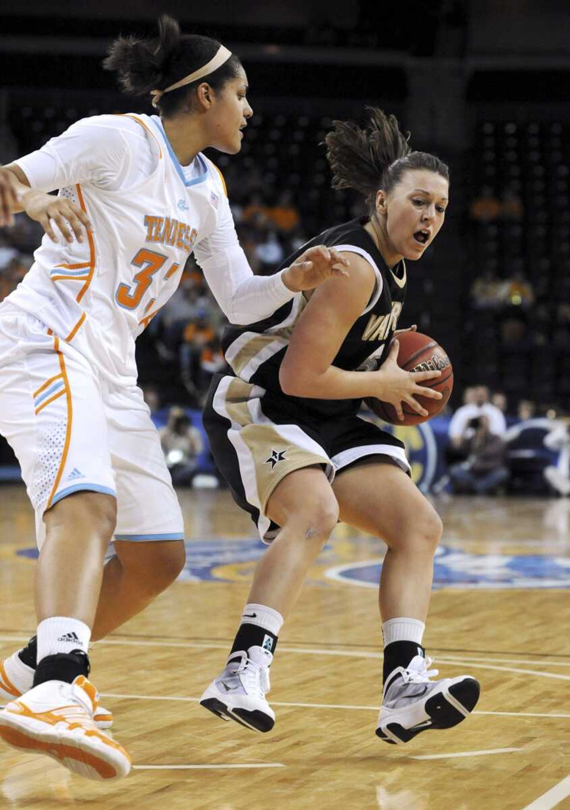 Vanderbilt guard Lauren Lueders, right, tries to drive past Tennessee forward Alyssia Brewer during their Southeastern Conference tournament game earlier this month. (ERIK LESSER ~ Associated Press)