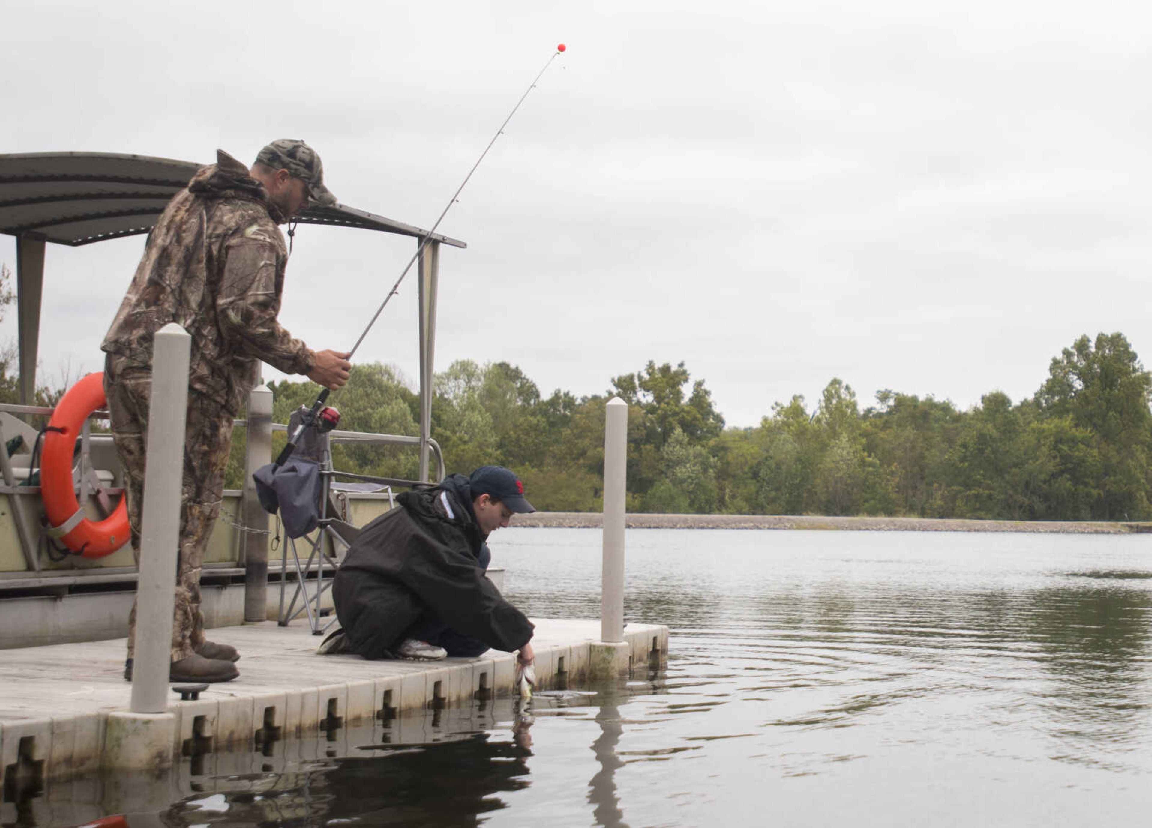 Nathan Crowe, 13, releases a largemouth bass during the inaugural Fishing Rodeo held Oct. 15, 2017 at Elks Lake in Cape Girardeau.