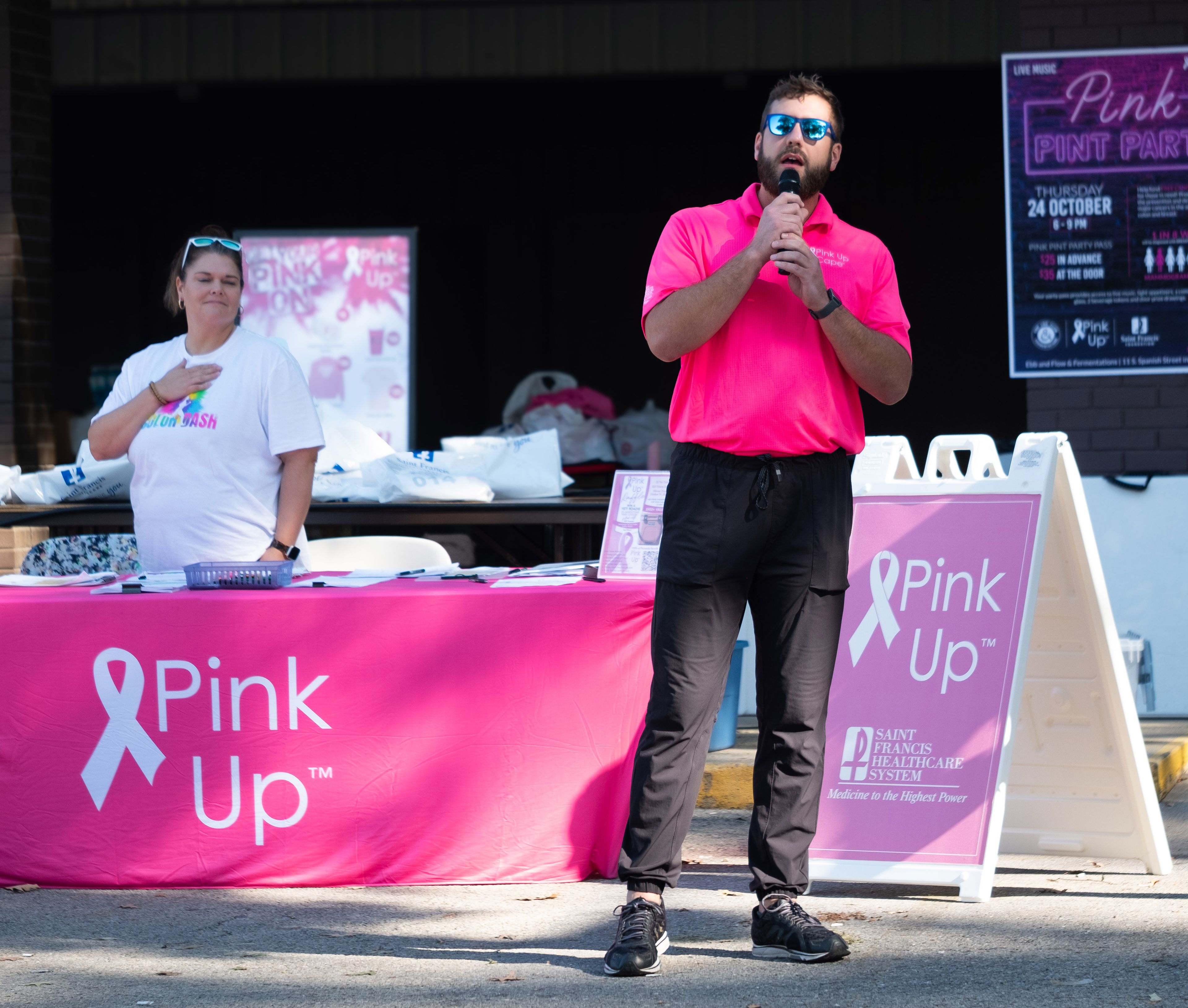 Nate Gautier, event organizer from Cape Girardeau, leads participants in a prayer of gratitude before the start of the Color Dash 5K.
