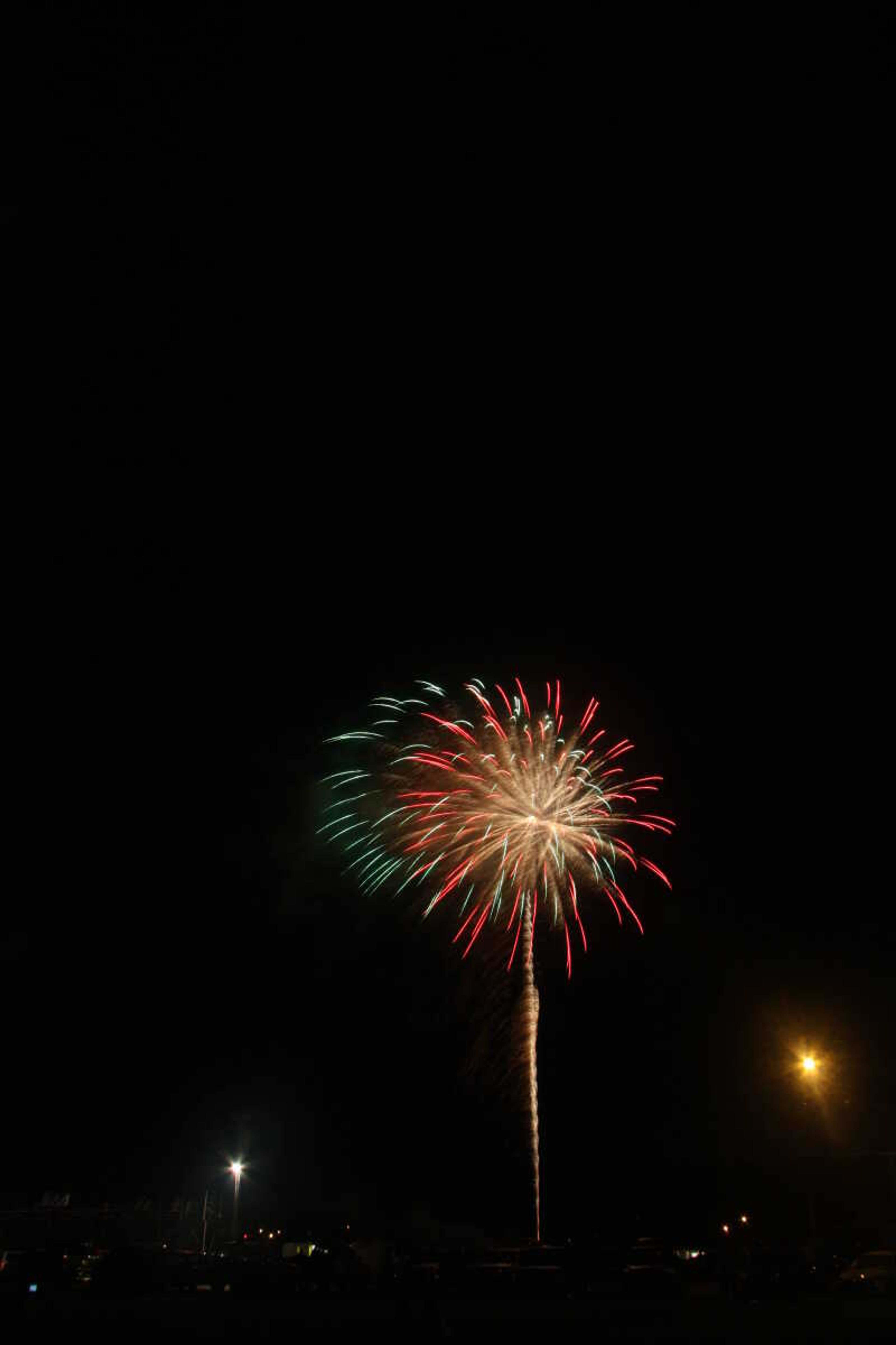 Picture of the fireworks display in Cape Girardeau's Arena Park, taken from a field south of the park.