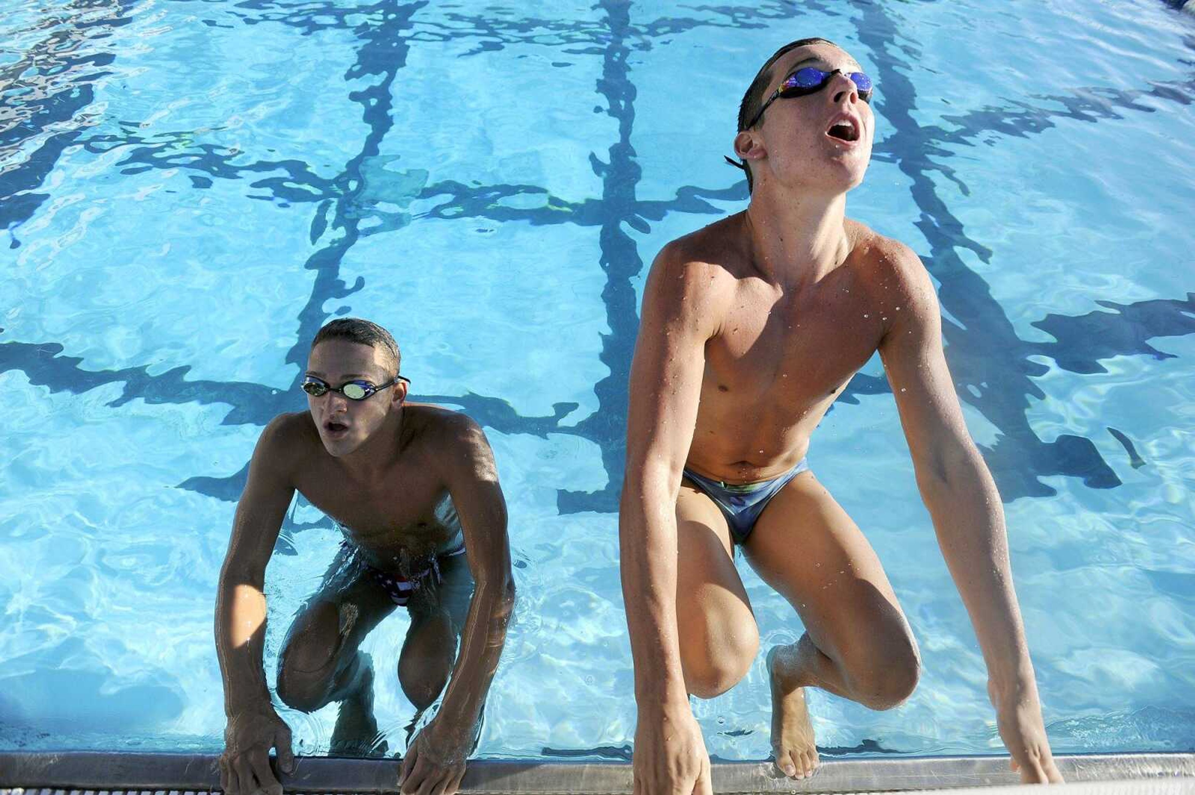 Cape Central's Brogan Davis, left, and Reagan Ragsdale take off in the Central Municipal Pool on Monday, Aug. 22, 2016, in Cape Girardeau.