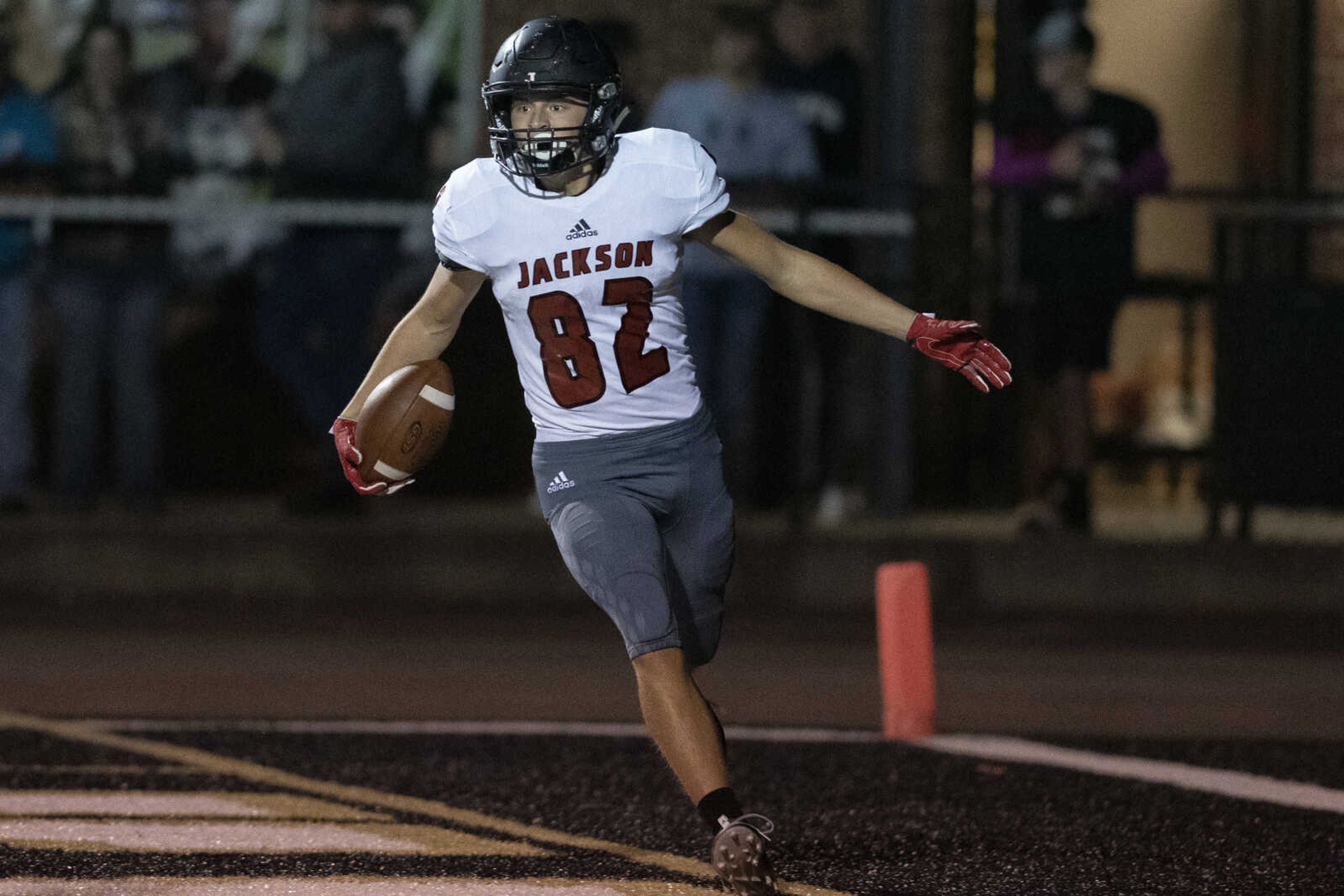 Jackson's Dalton Skrob (82) reacts to scoring a touchdown during the Jackson Indians' 35-14 victory over Farmington on Friday, Oct. 4, 2019, in Farmington, Missouri.