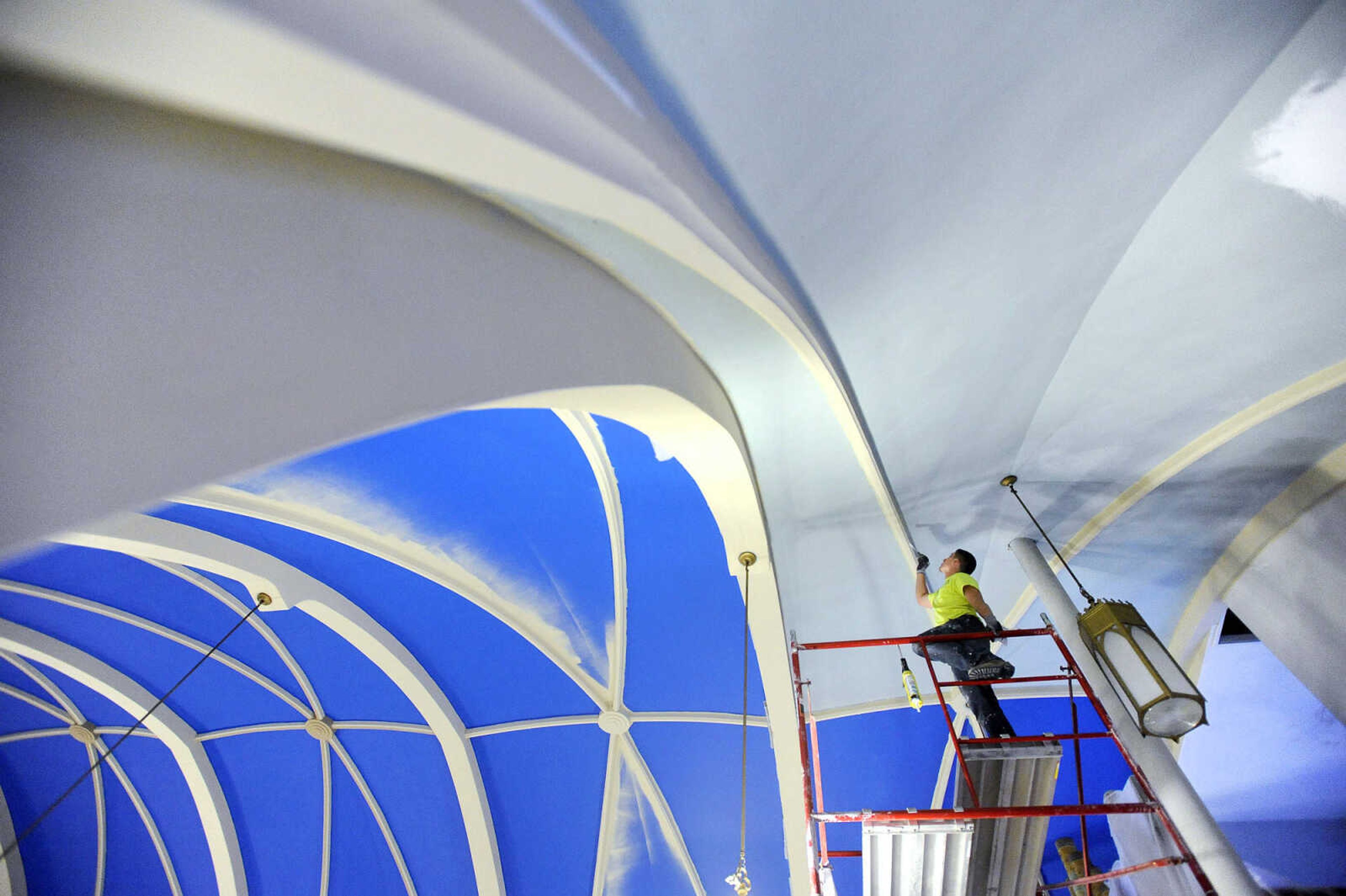 LAURA SIMON ~ lsimon@semissourian.com

Kyle Thompson braces himself atop the scaffolding in the choir loft as he paints the ceiling inside St. John's Catholic Church in Leopold, Missouri on March 4, 2016.