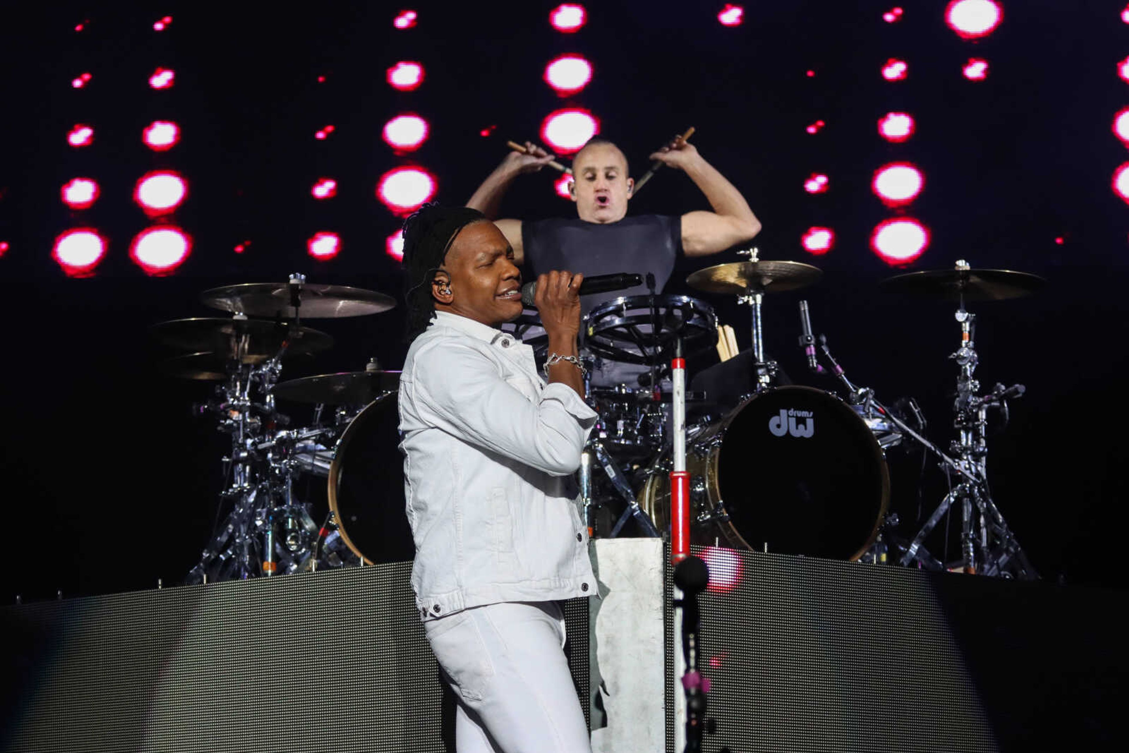 Michael Tait (front) sings while drummer Duncan Phillps perform Friday, Nov. 12 at the Show Me Center. The two are part of the band Newsboys.