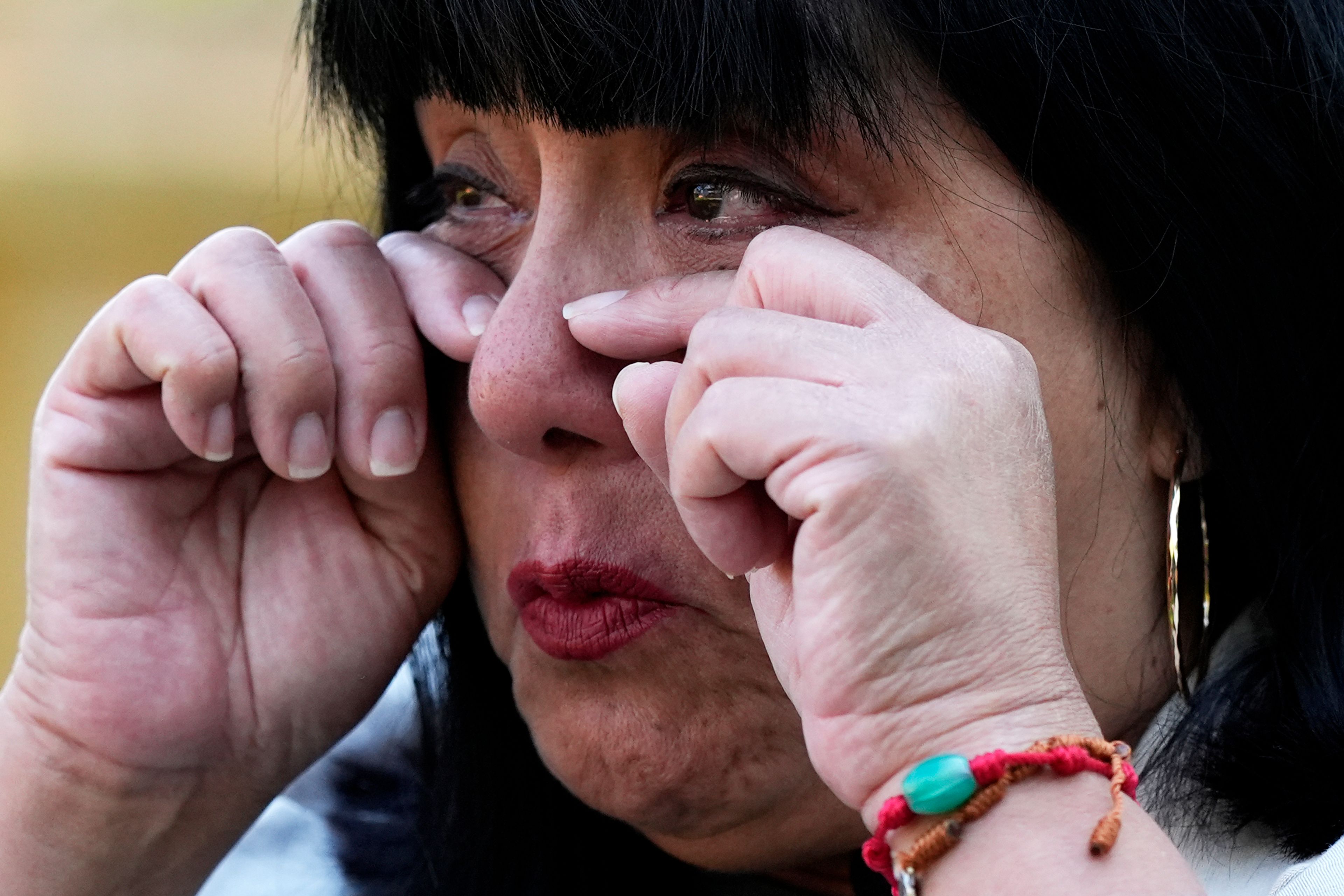 Pastor Julie Contreras wipes tears as she has an interview with a reporter in Waukegan, Ill., Monday, Sept. 17, 2024. (AP Photo/Nam Y. Huh)