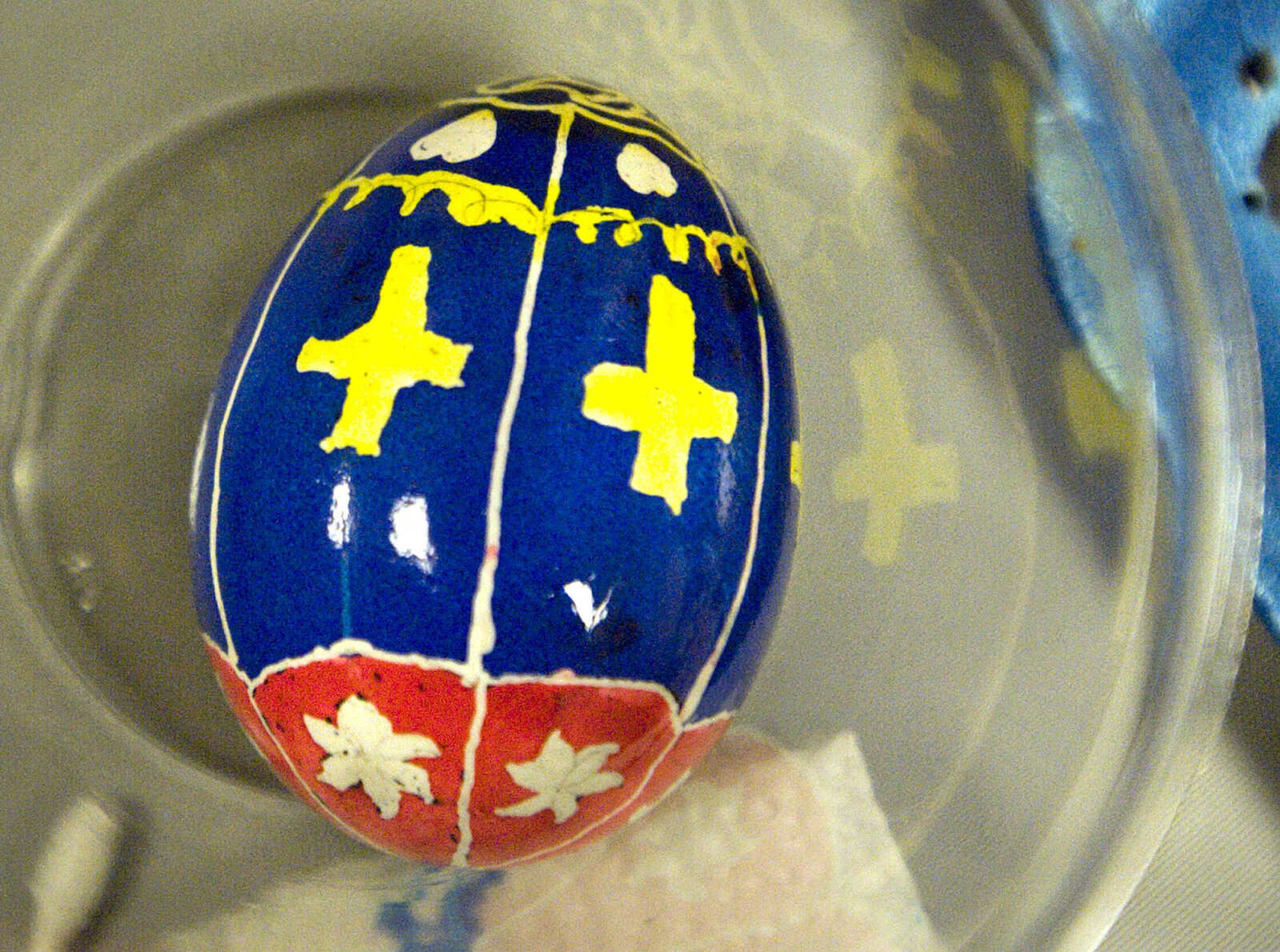 LAURA SIMON ~ lsimon@semissourian.com
A finished egg takes shelter in a cup Tuesday, March 19, 2013 during the Wonderful World of Pysanky workshop at Southeast Missouri State University's River Campus.