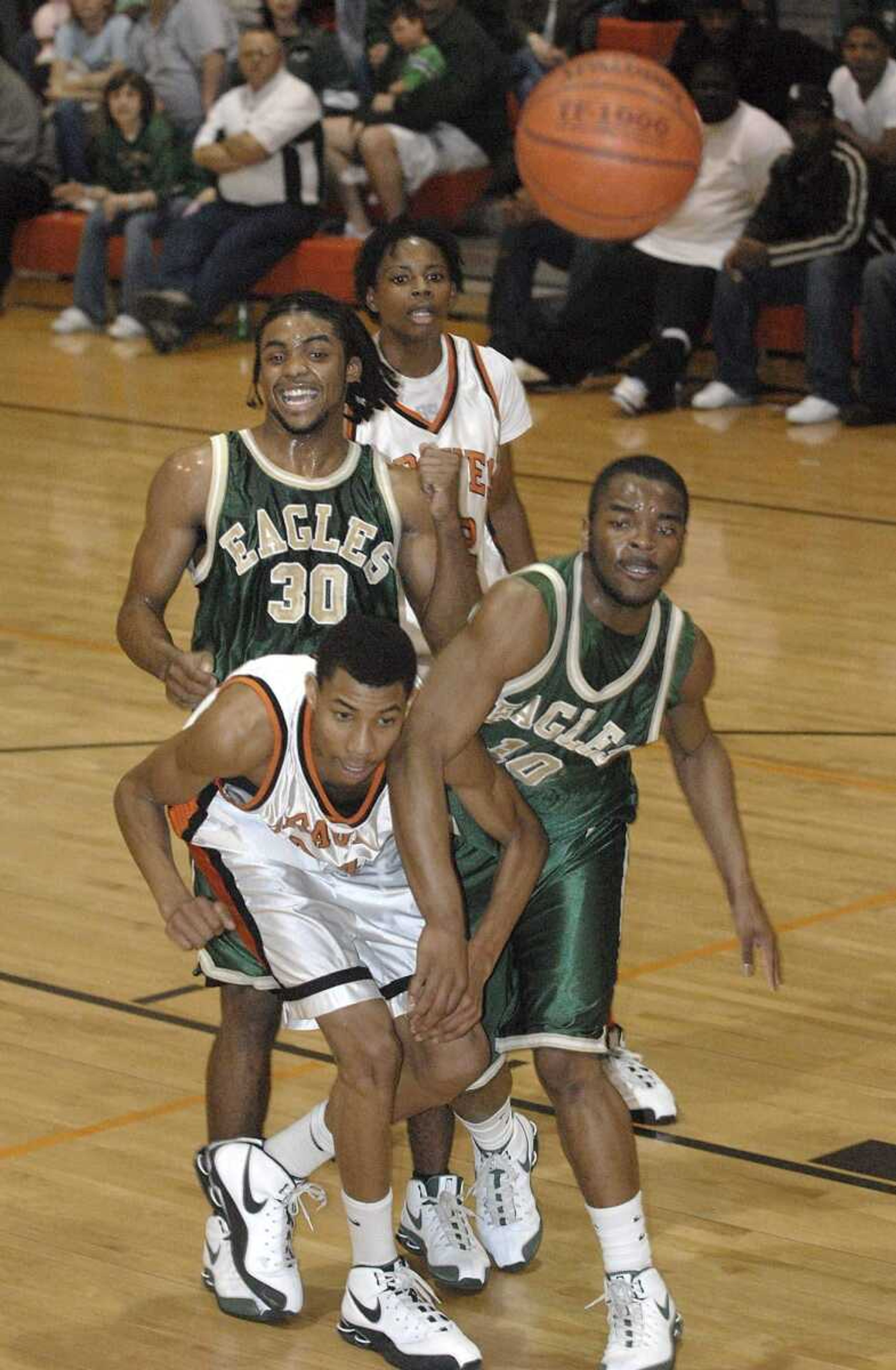 FRED LYNCH ~ flynch@semissourian.com
Scott County Central's Otto Porter, left, and New Madrid County Central's Dontre Jenkins miss a rebound with New Madrid's G'Darius Stevenson and Scott County's Desmin Williams in the first quarter Friday at Scott County Central.