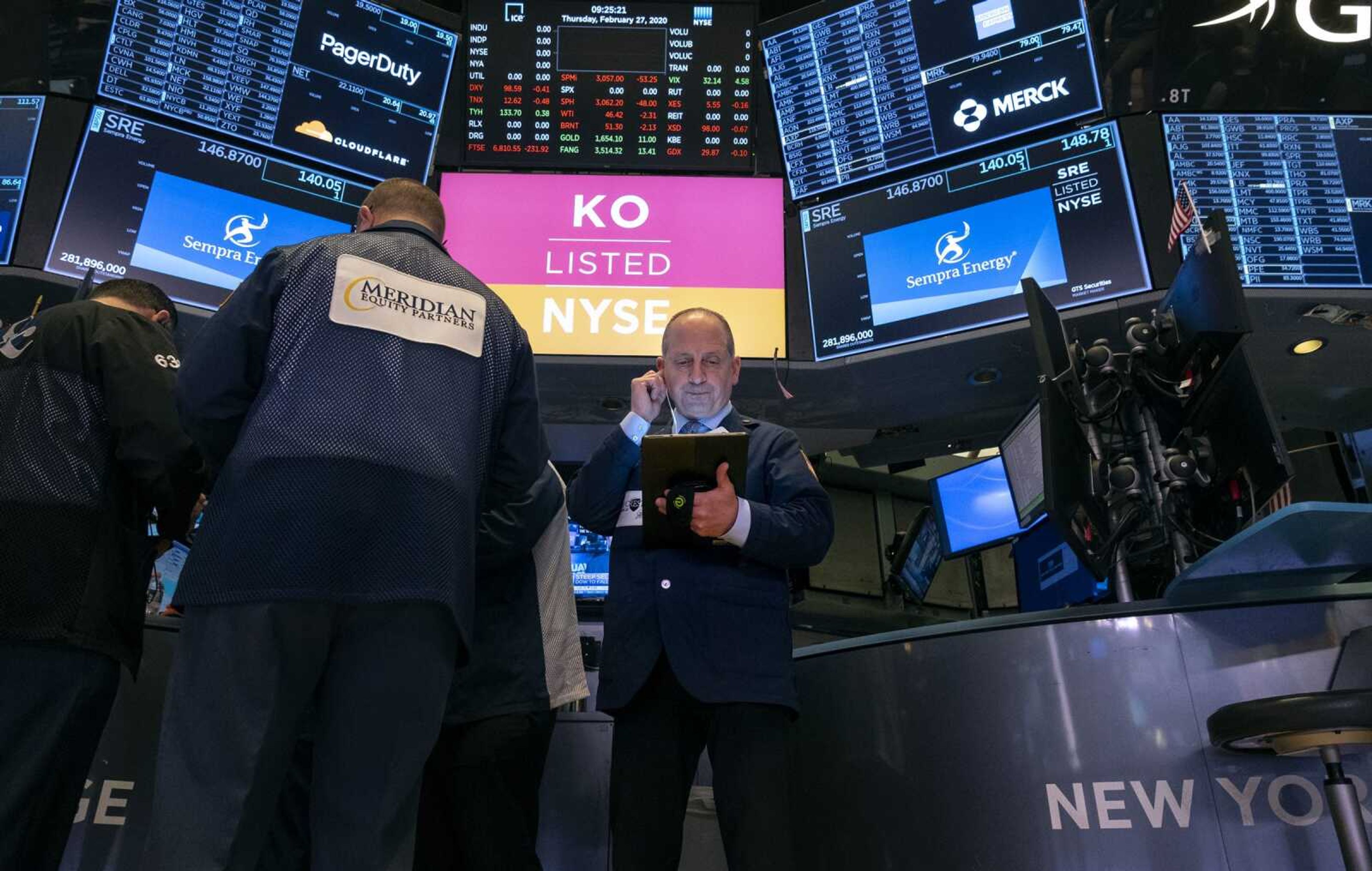 Traders work on the floor of the New York Stock Exchange on Thursday.