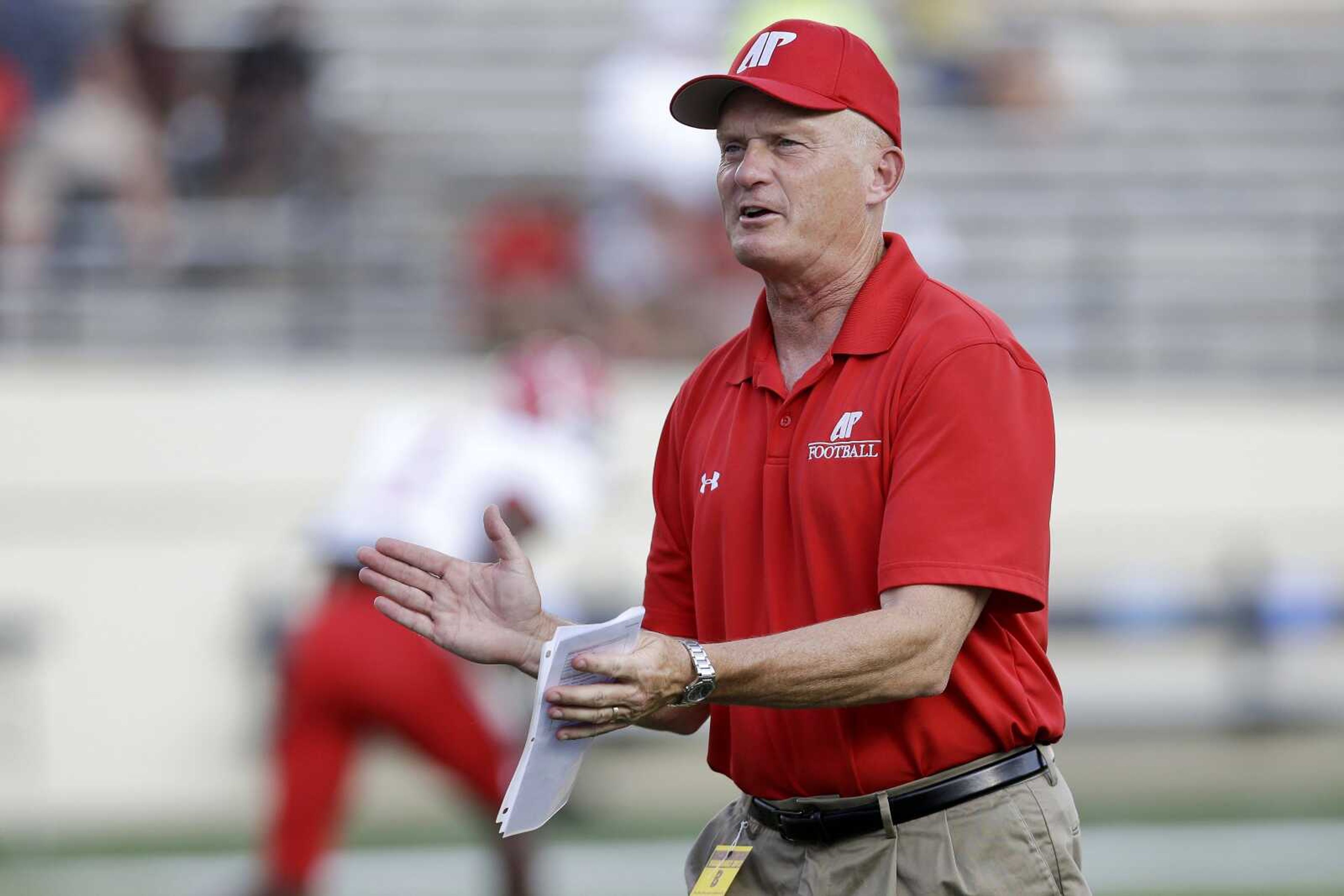 Austin Peay head coach Kirby Cannon watches his players warm up before an NCAA college football game between Austin Peay and Vanderbilt on Saturday, Sept. 7, 2013, in Nashville, Tenn. (AP Photo/Mark Humphrey)