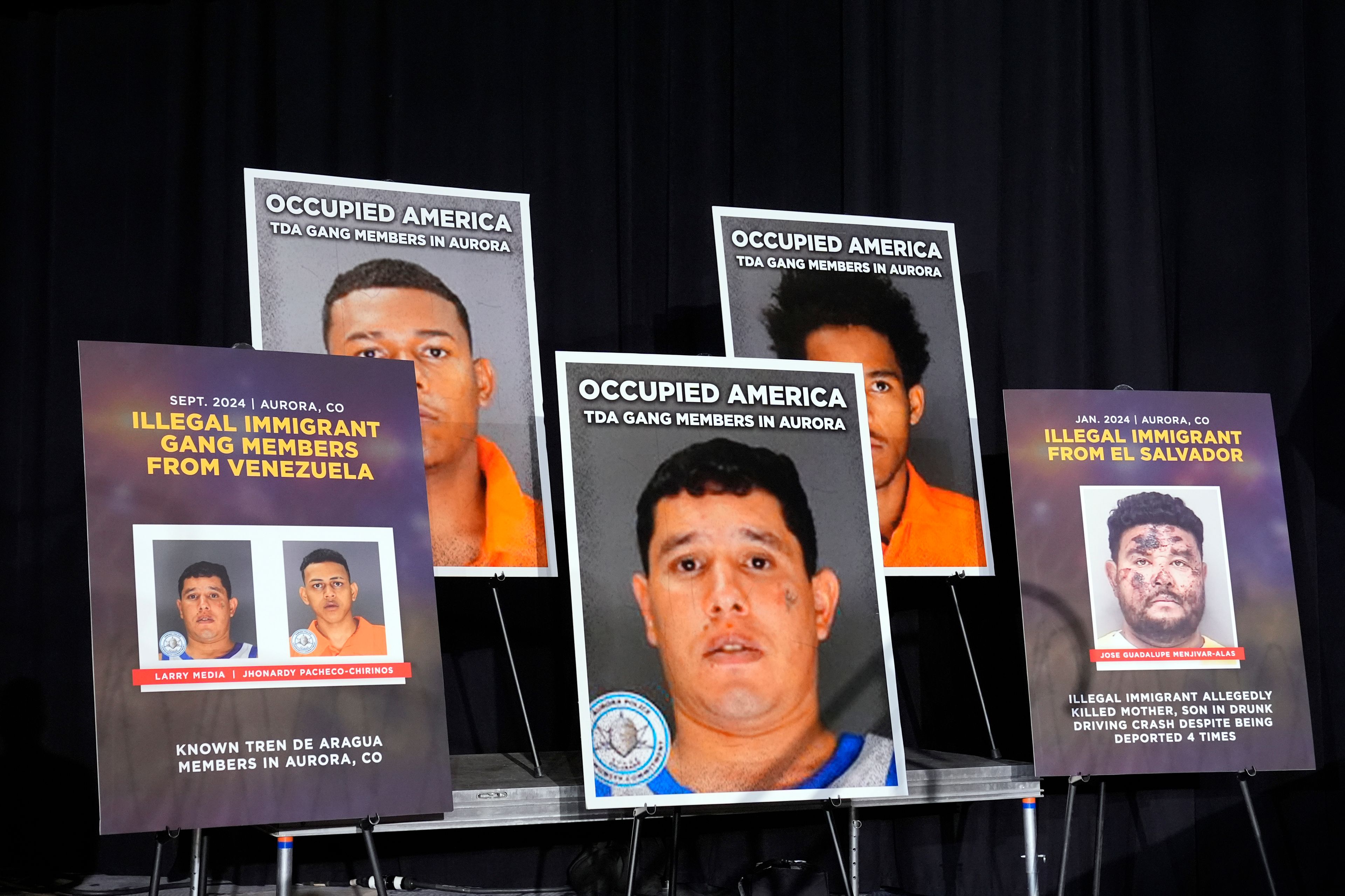 Posters are displayed in easels before Republican presidential nominee former President Donald Trump speaks at a campaign rally at the Gaylord Rockies Resort & Convention Center, Friday, Oct. 11, 2024, in Aurora, Colo. (AP Photo/Alex Brandon)