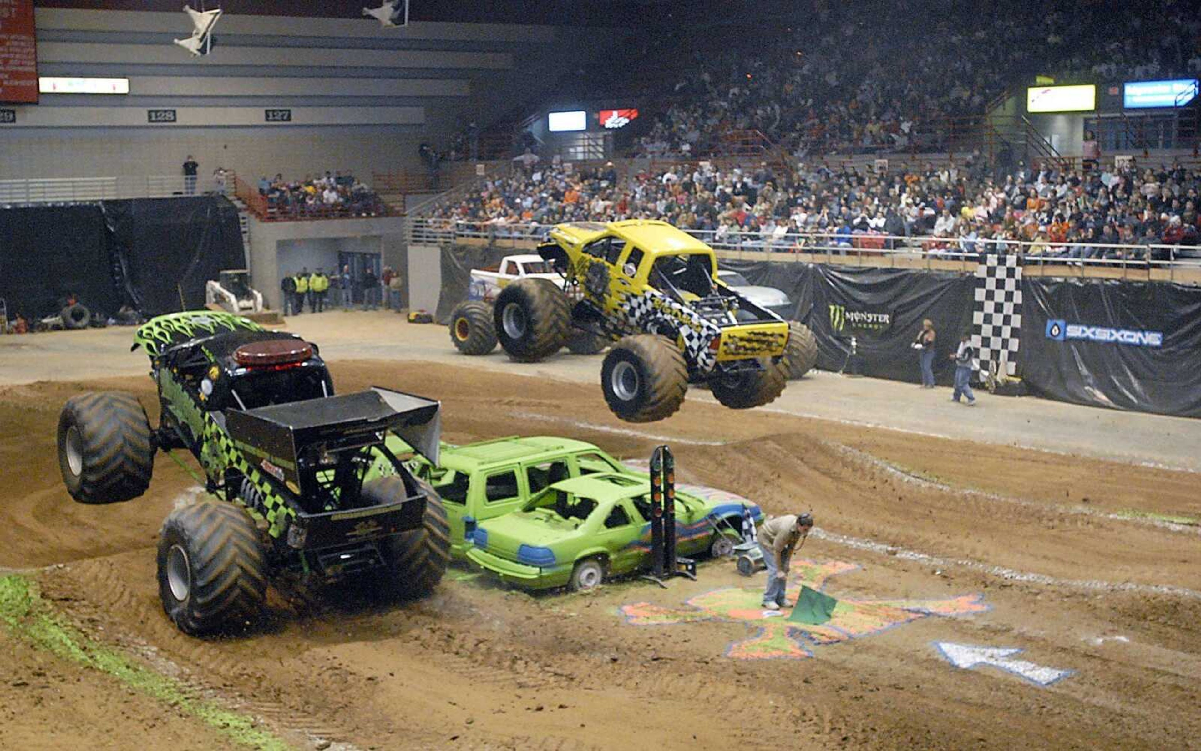 Monster Patrol, left, took on Big Dawg during the monster truck and quad races Saturday at the Show Me Center. (Kit Doyle)